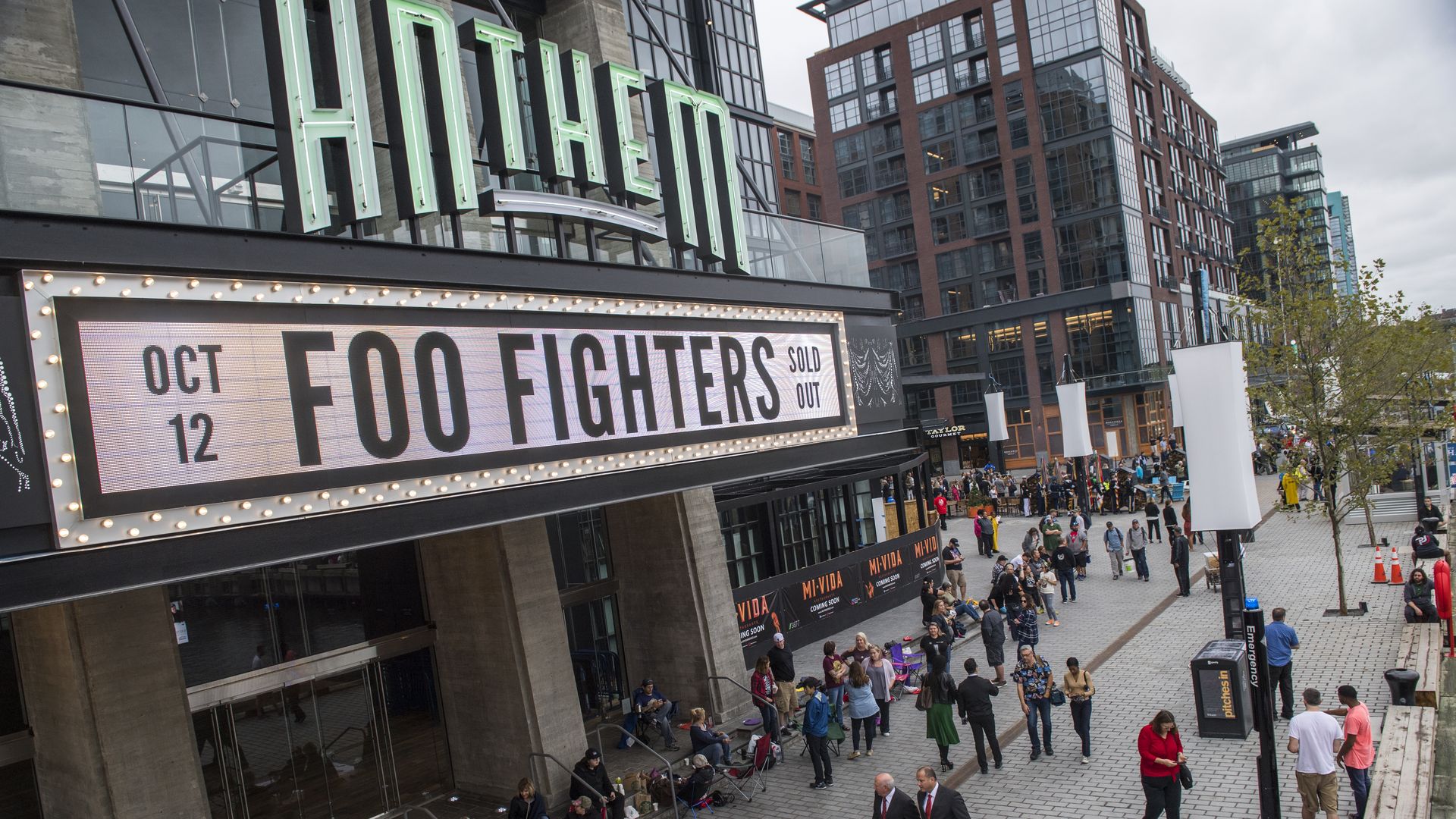 An exterior photograph of the Anthem, with people walking outside at The Wharf