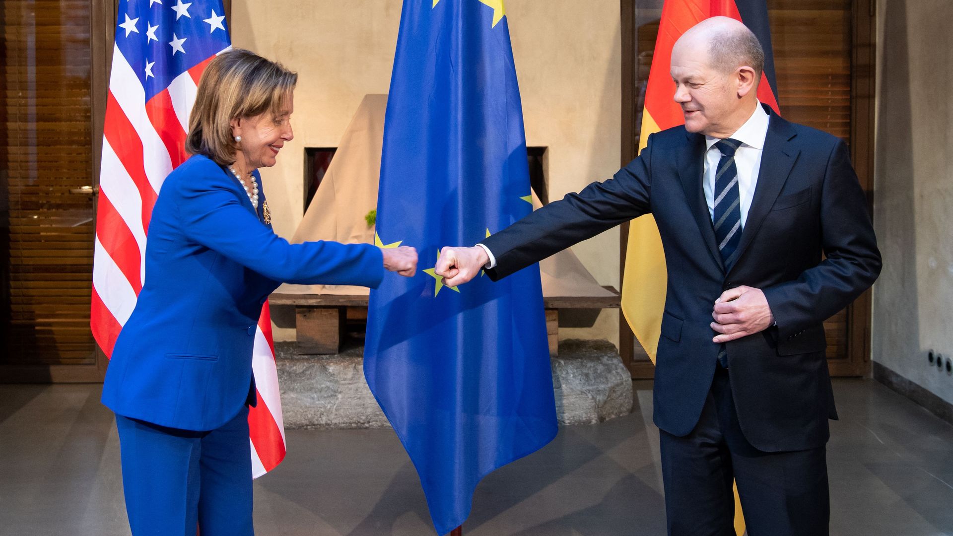 House Speaker Nancy Pelosi is seen fist-bumping with German Chancellor Olaf Scholz.