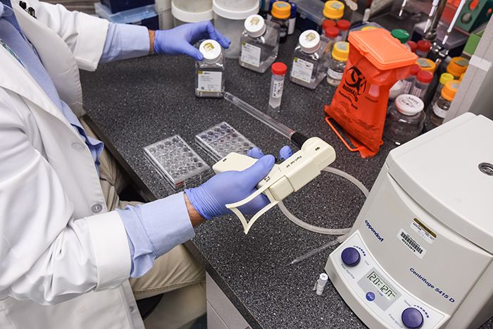 An Atrium Health employee handles a Covid-19 vaccine
