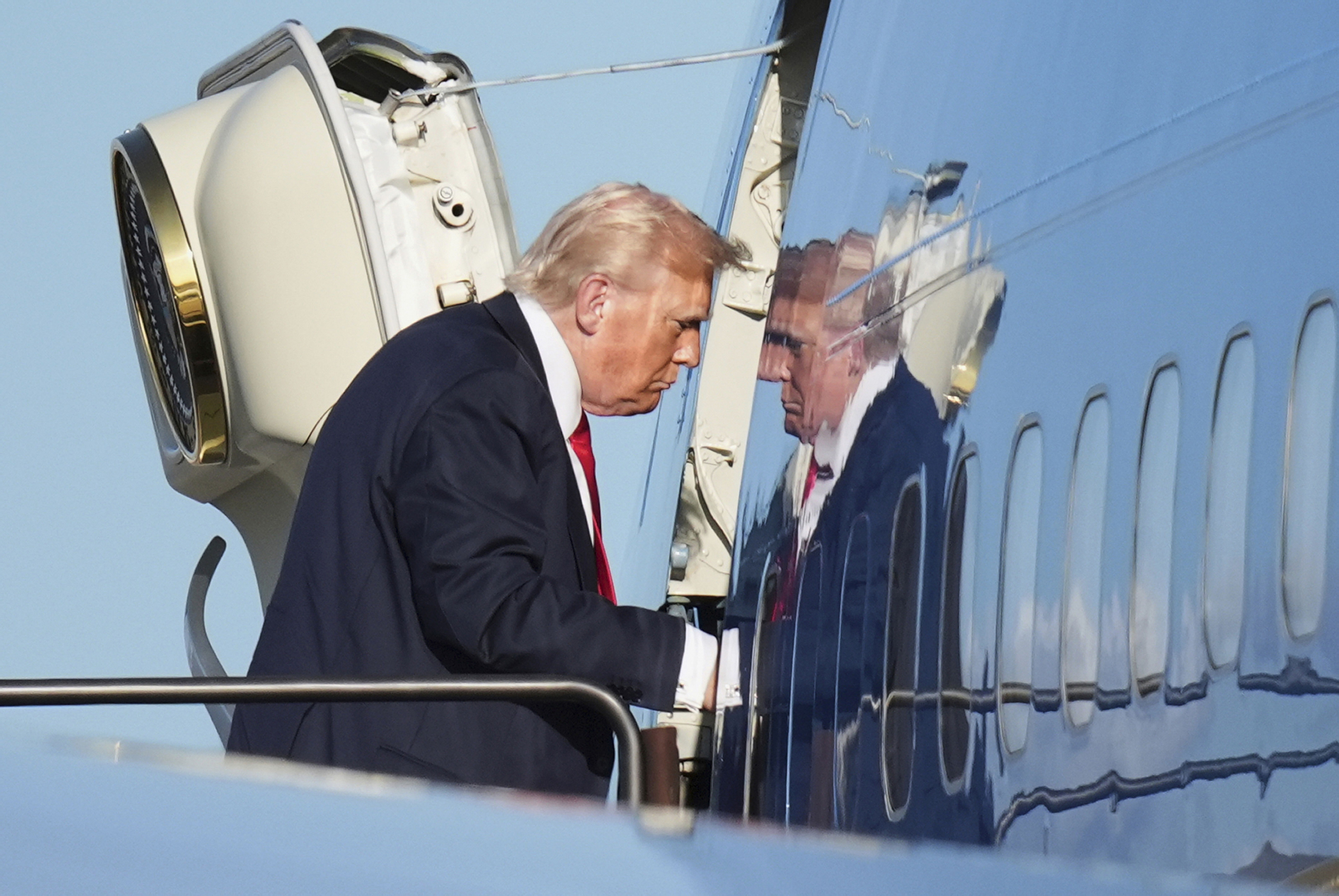 President Trump boards Air Force One at Newark International Airport en route to D.C. yesterday.