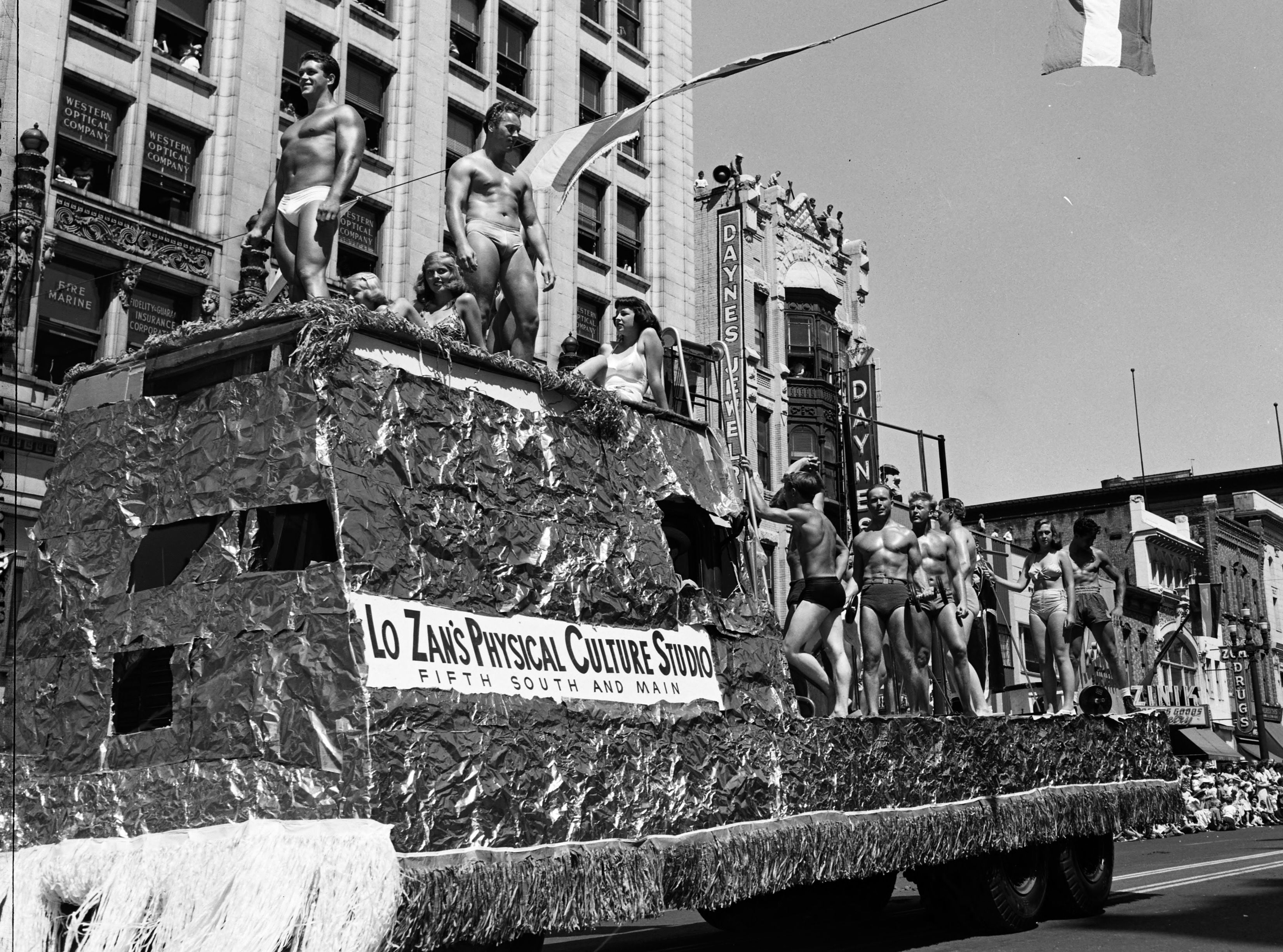 Body builders on a parade float in briefs, 1949.