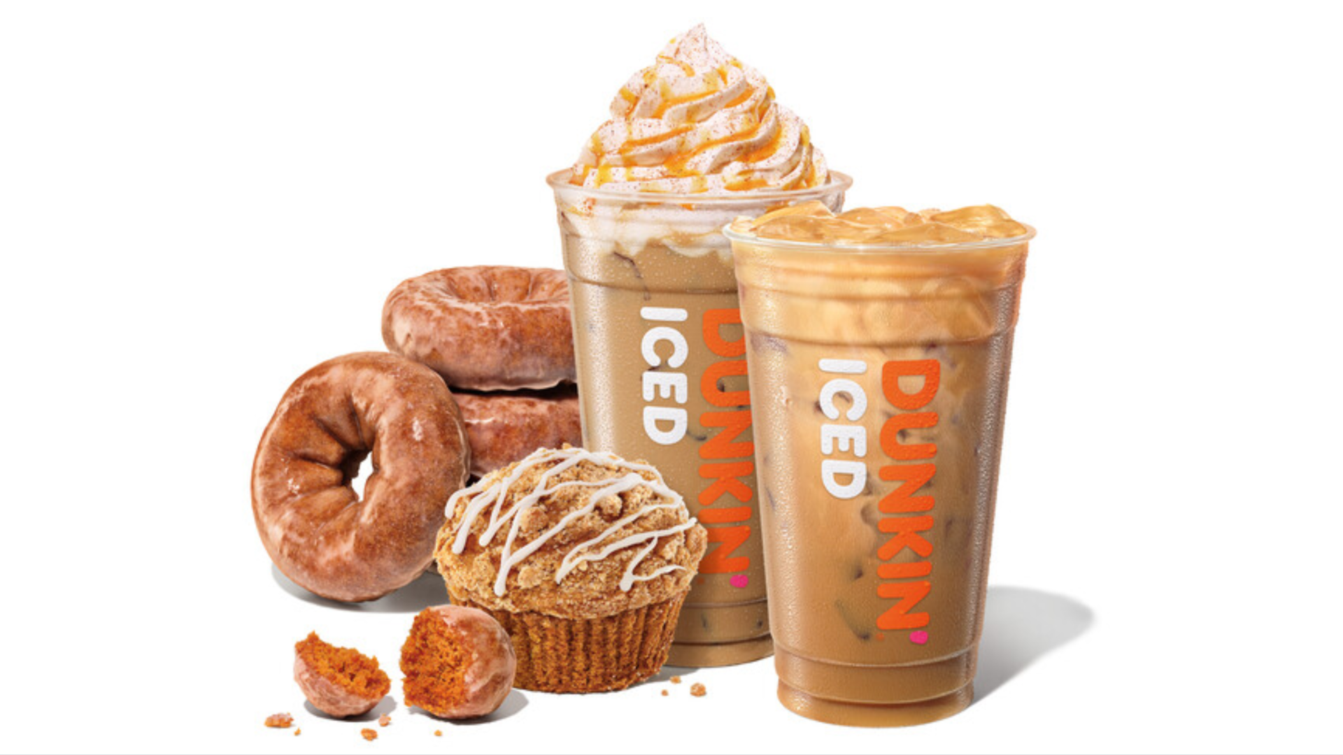 Assortment of Dunkin' pumpkin spice items from doughnuts, muffin to two beverages