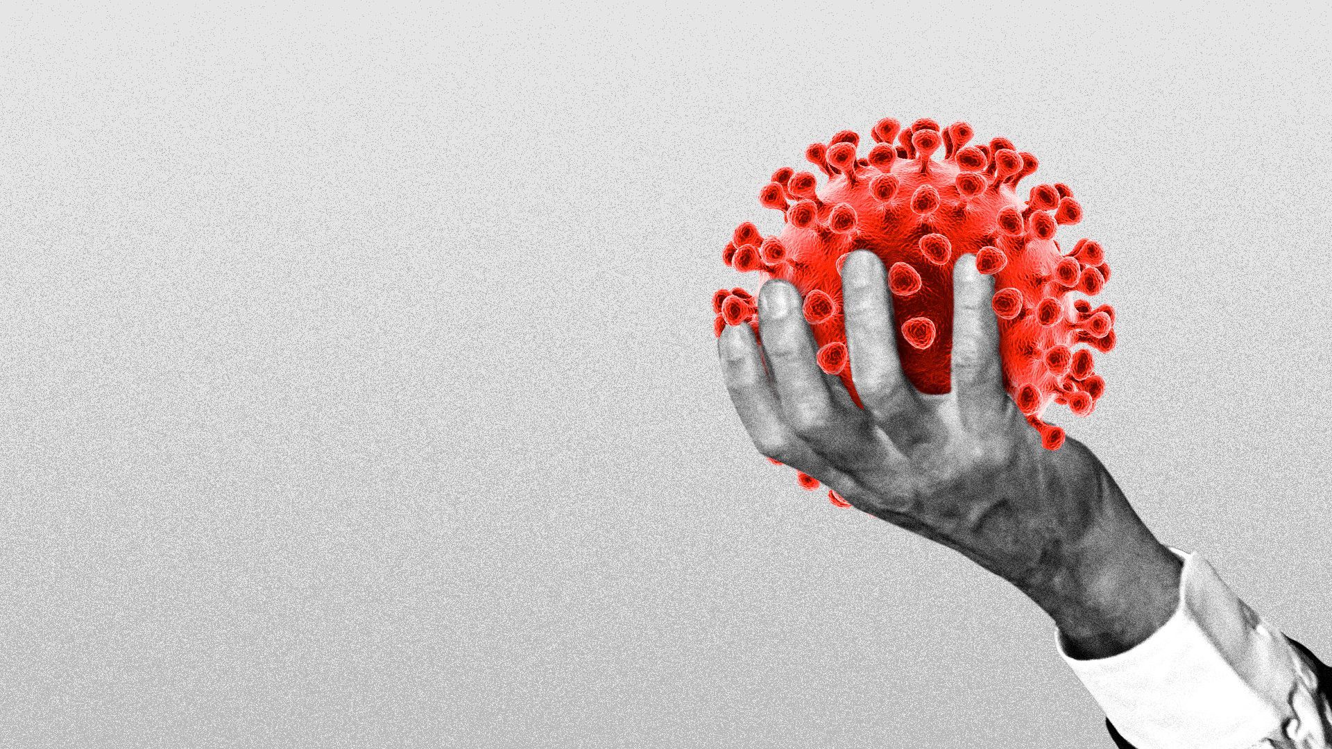 Illustration of a hand holding a coronavirus cell.