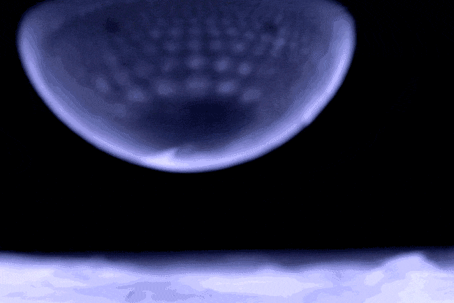 A soap bubble in the process of freezing.