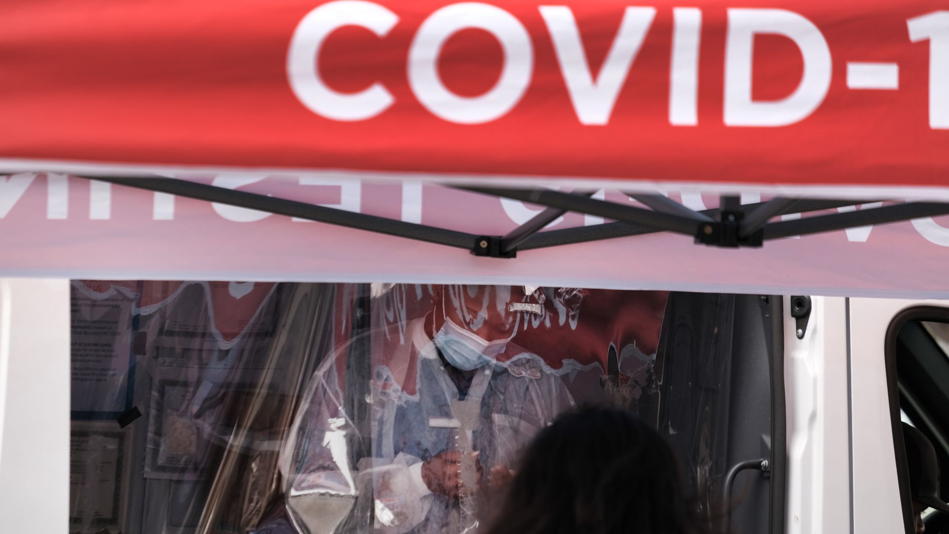 medical worker administers tests at a Covid-19 testing site in Brooklyn on April 18, 2022 in New York City.