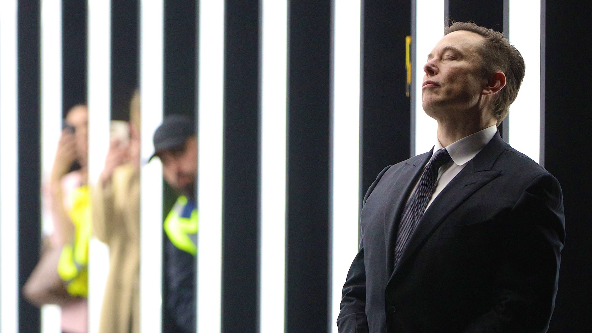 Tesla CEO Elon Musk contemplates during the official opening of the new Tesla electric car manufacturing plant on March 22, 2022 near Gruenheide, Germany. 