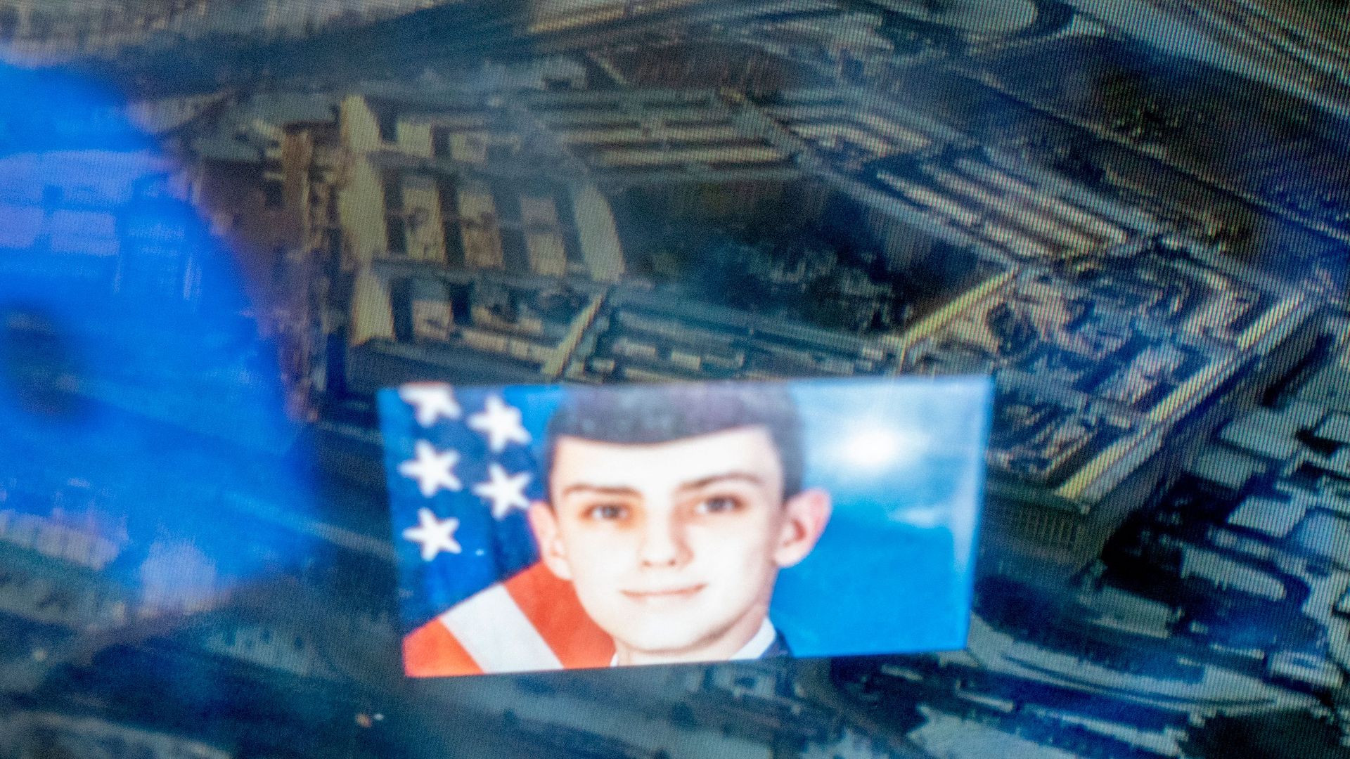 This photo illustration created on April 13, 2023, shows the Discord logo and the suspect, national guardsman Jack Teixeira, reflected in an image of the Pentagon in Washington, DC. 