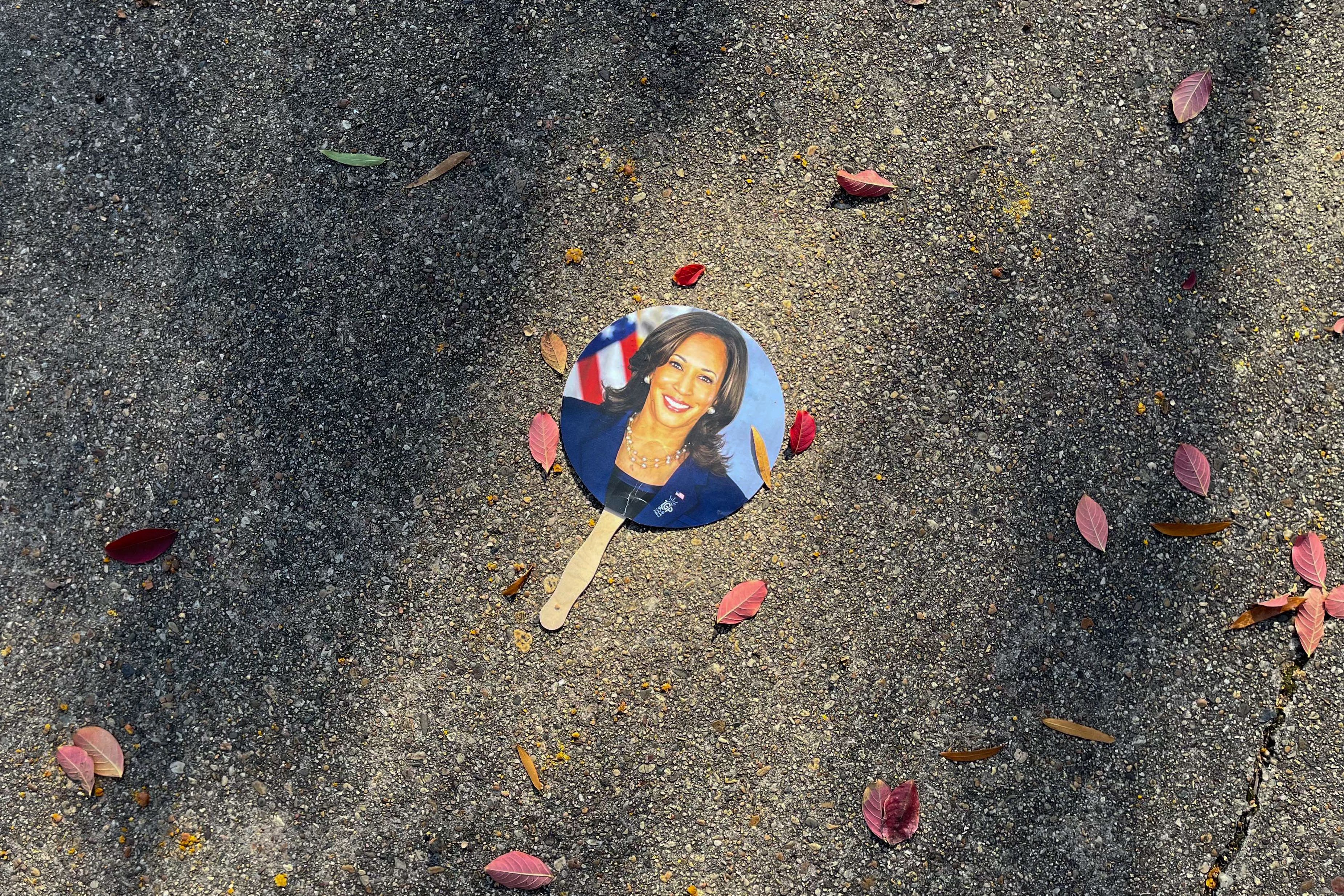 A photo showing a hand fan with a picture of Vice President Kamala Harris on it.