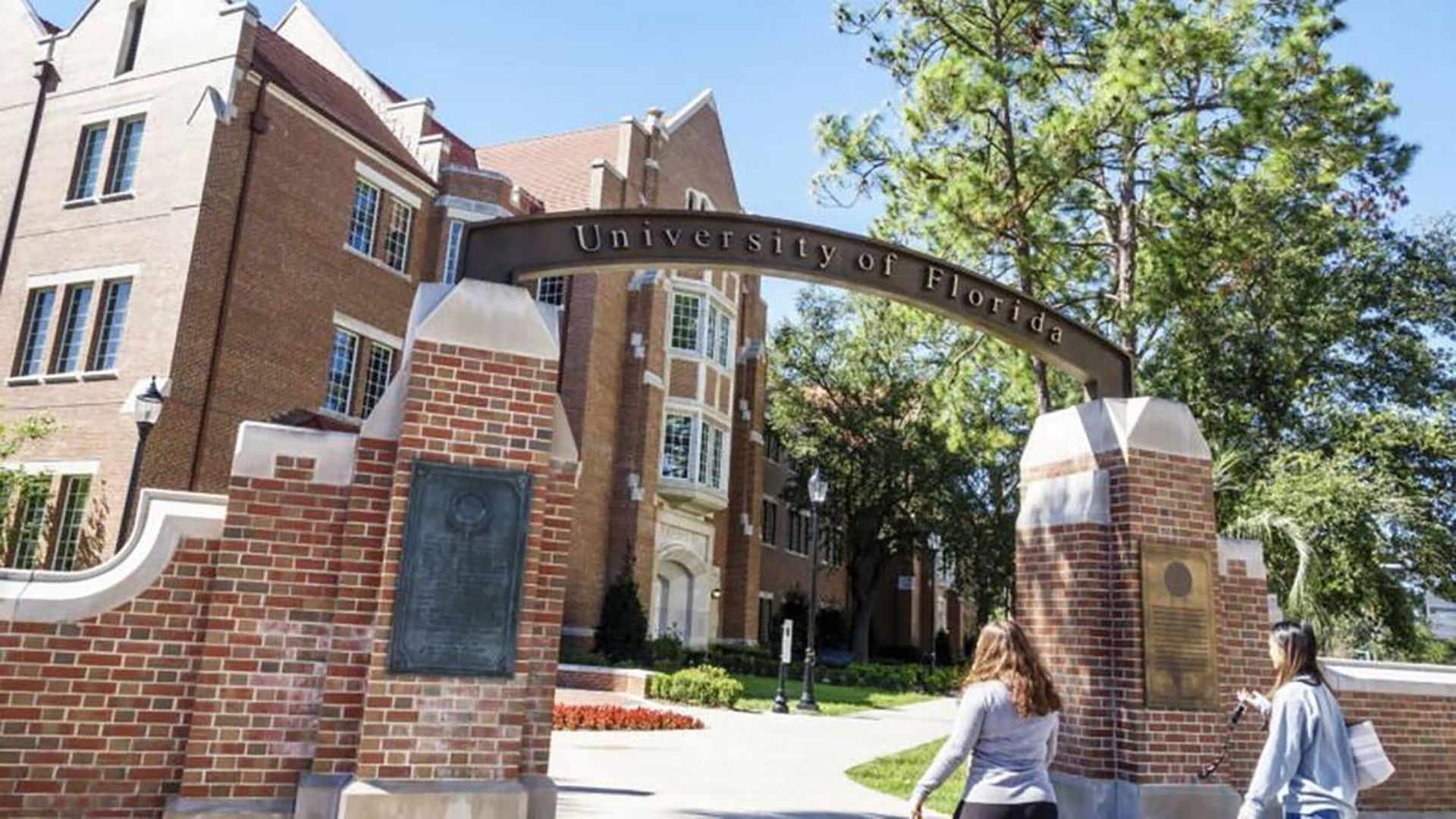 An image of a building of the University of Florida from the outside along with an entrance to the campus with the school's name on it
