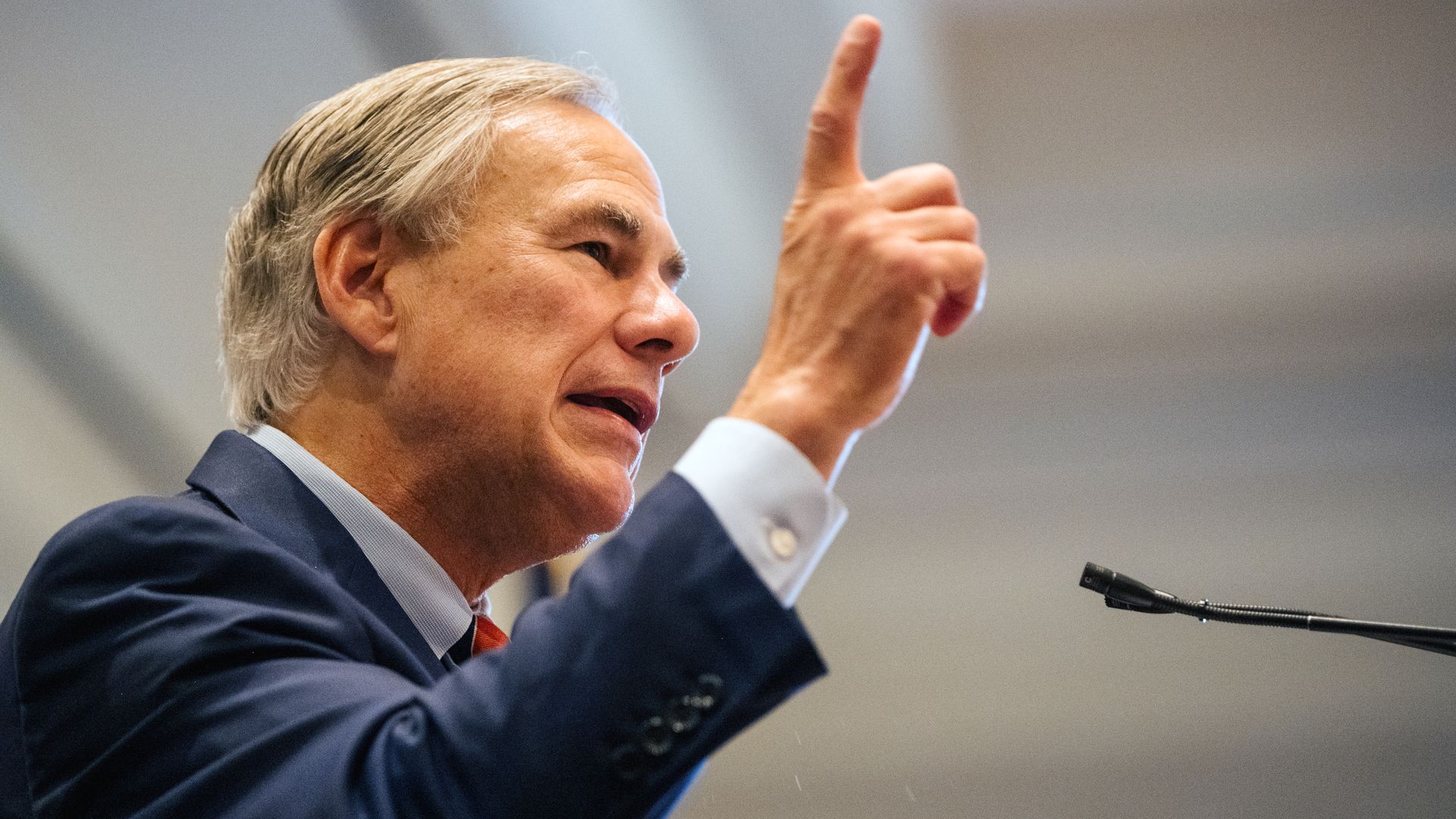 Greg Abbott with his finger in the air