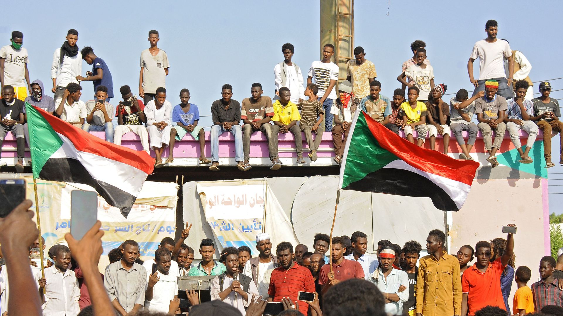 Sudanese protesters take part in a protest in Port Sudan in the east of the country to demand the government's transition to civilian rule, on October 21, 2021.