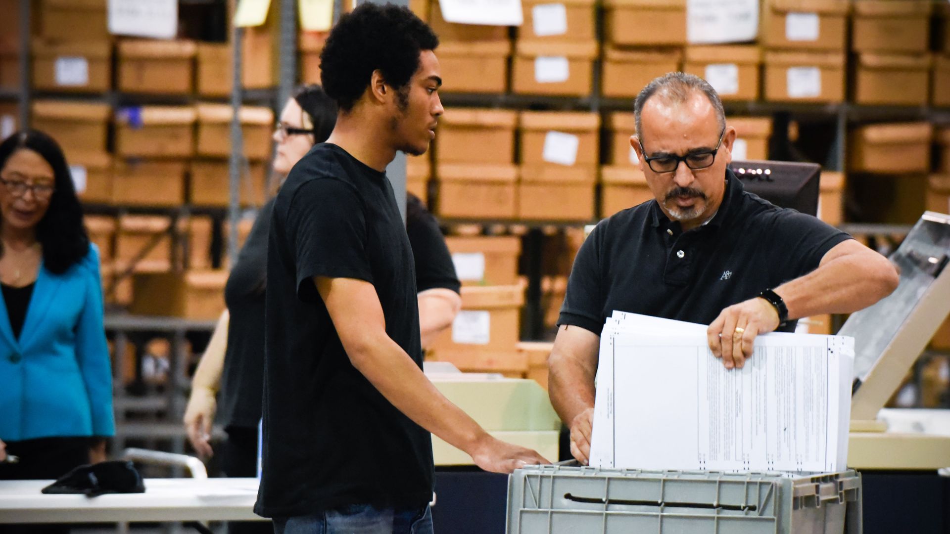 Palm Beach County election officials prepare to recount ballots on Thursday in West Palm Beach, Florida.