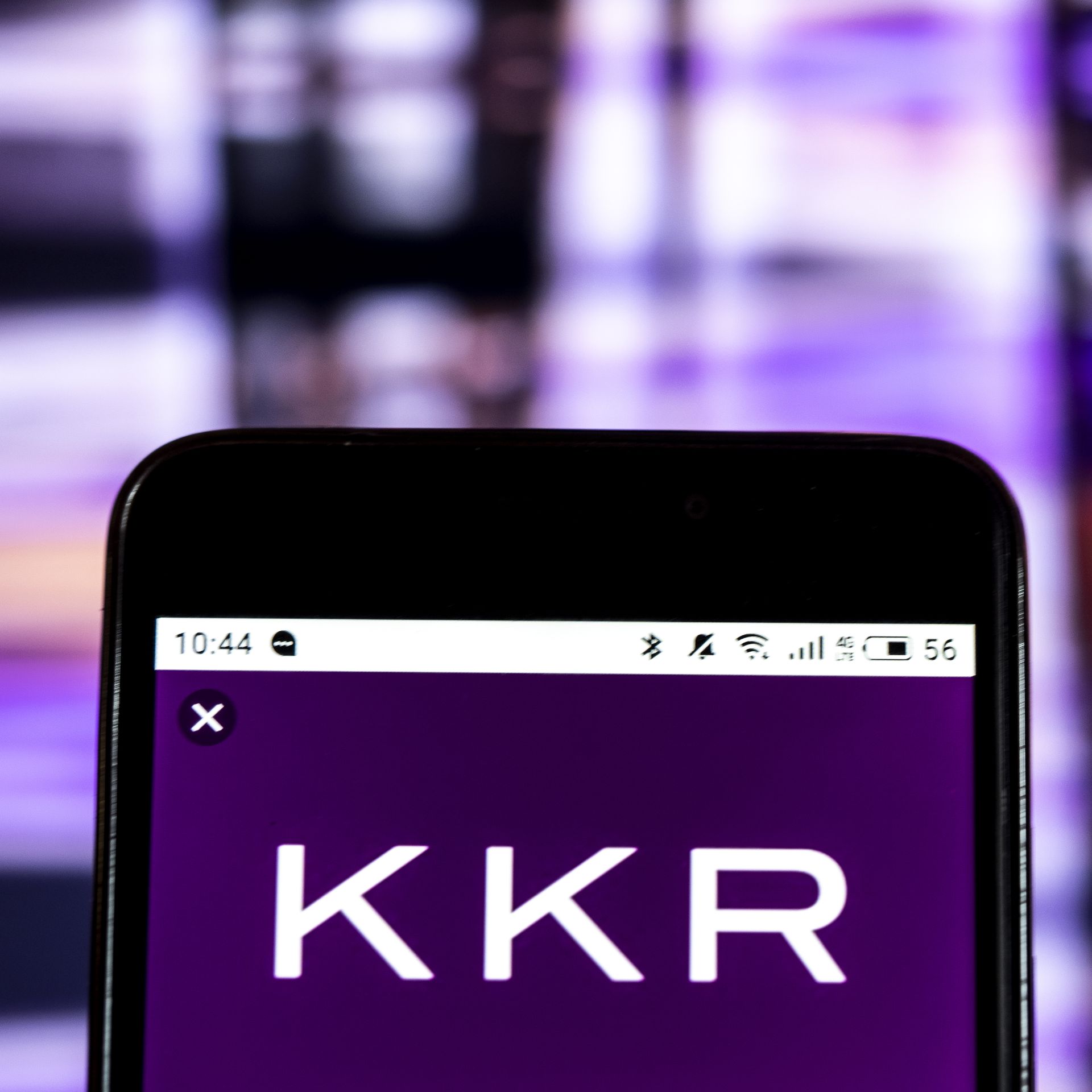 A KKR logo on a phone