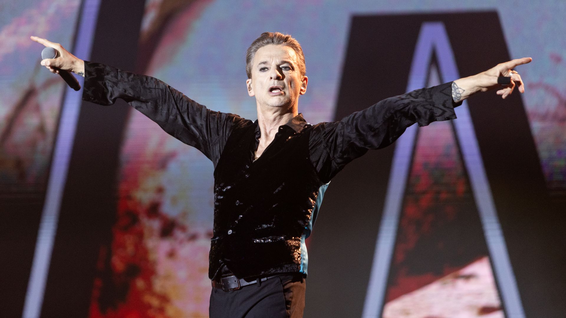 Depeche Mode's lead singer performs on stage. 