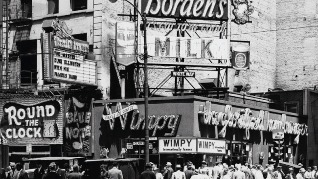 GIF of a an old photo that turns into a new building 