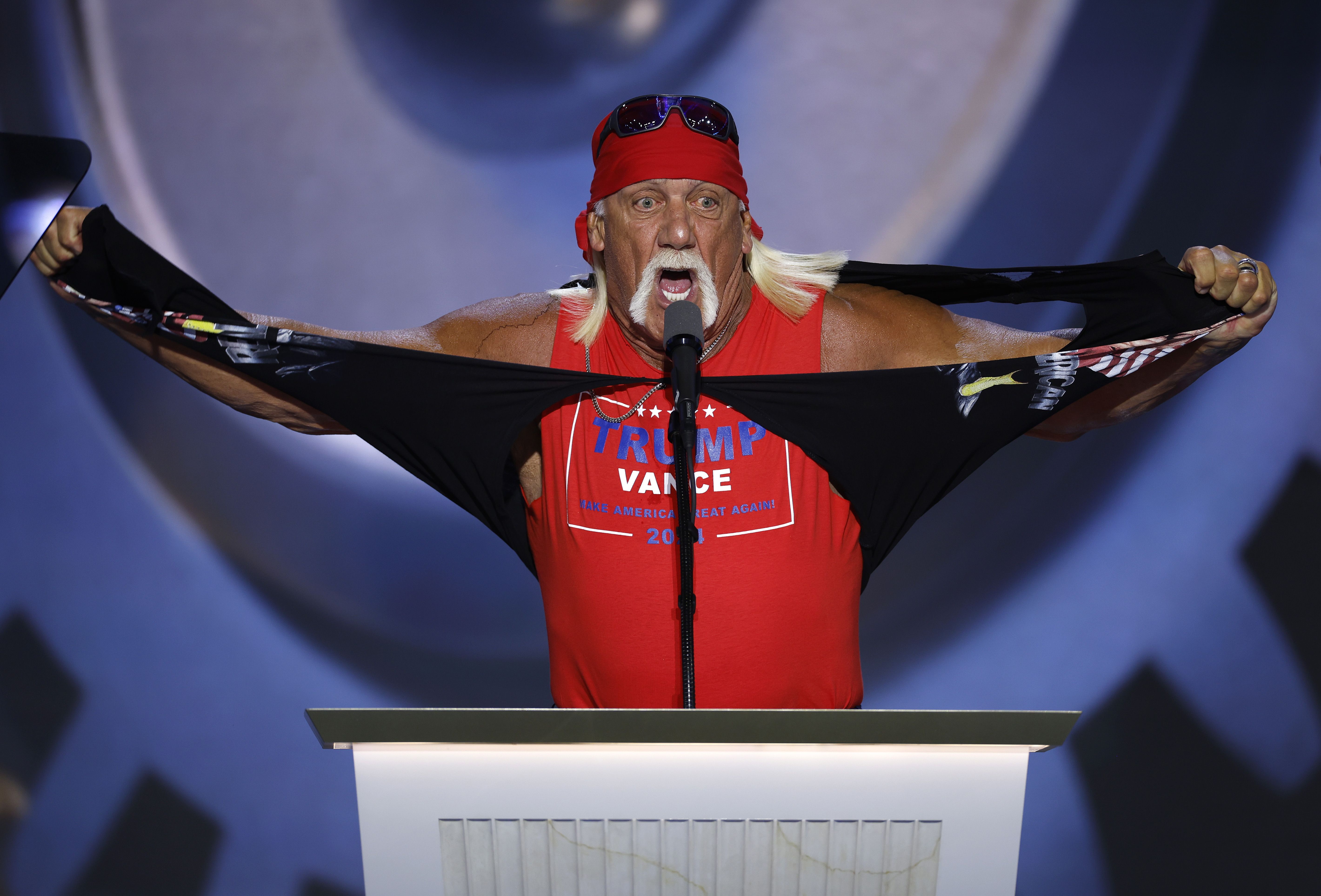 Hulk Hogan rips his shirt as he speaks onstage in Milwaukee. 