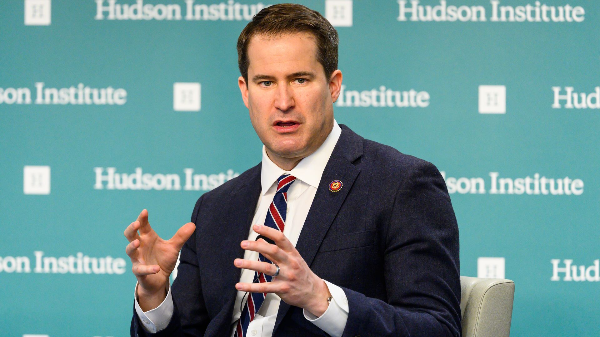 Seth Moulton sitting and gesturing with his hands. 