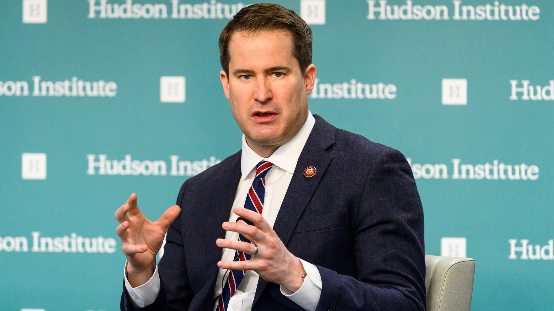Seth Moulton sitting and gesturing with his hands.
