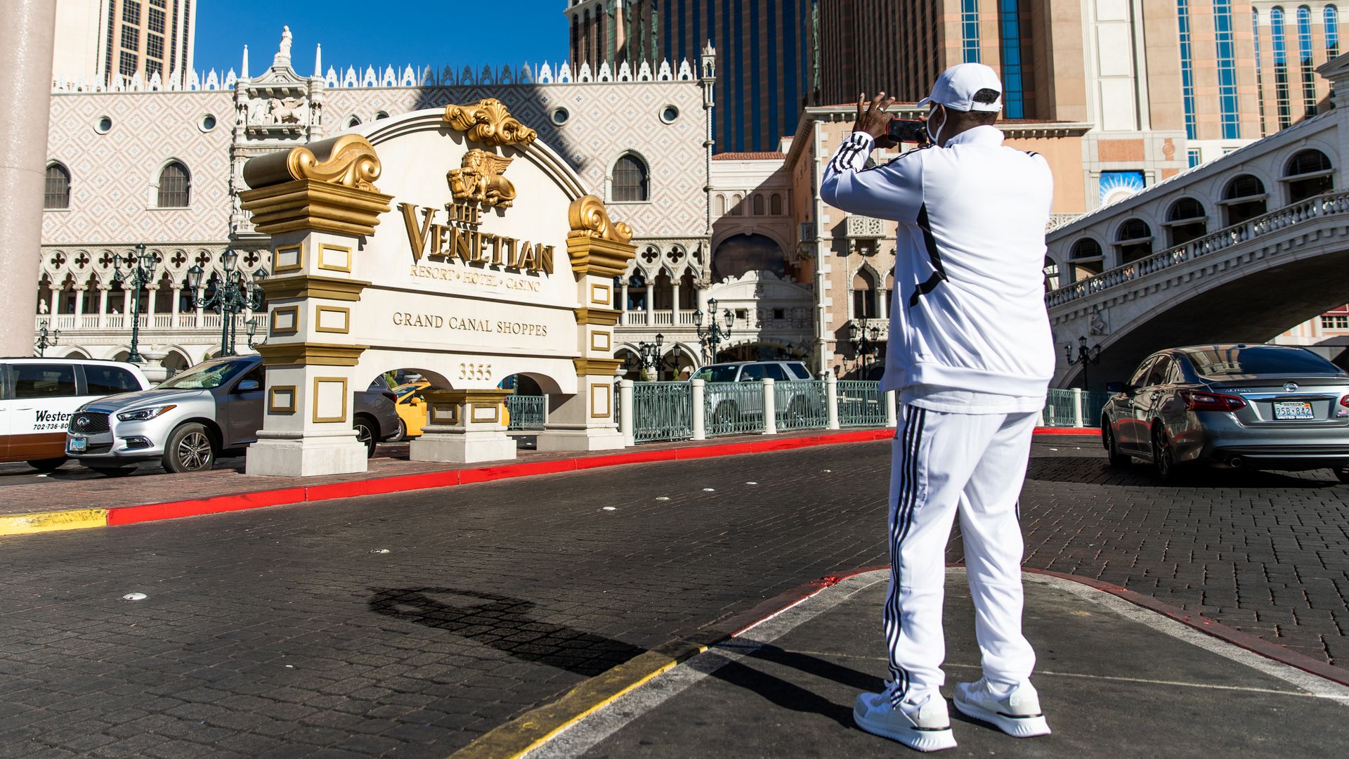 Tourist takes a picture of Venetian property