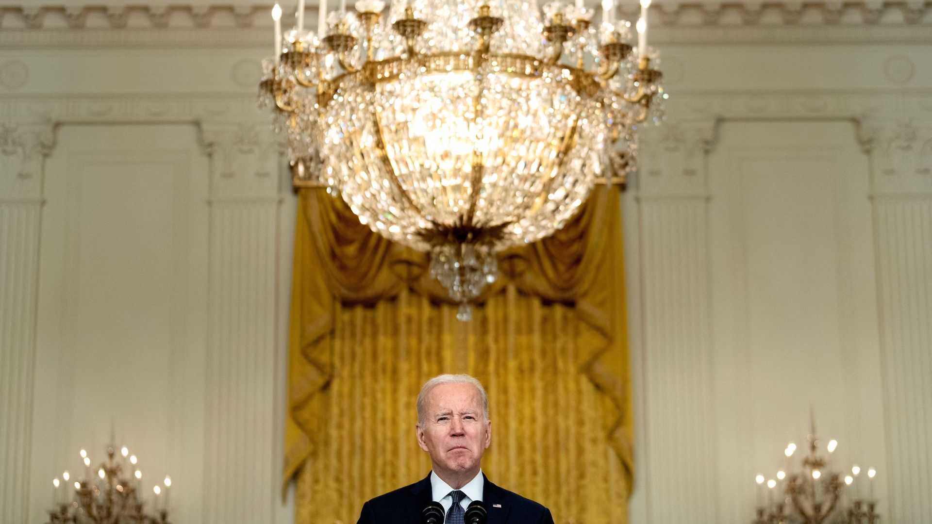 President Biden is seen in the East Room delivering remarks about Russia.