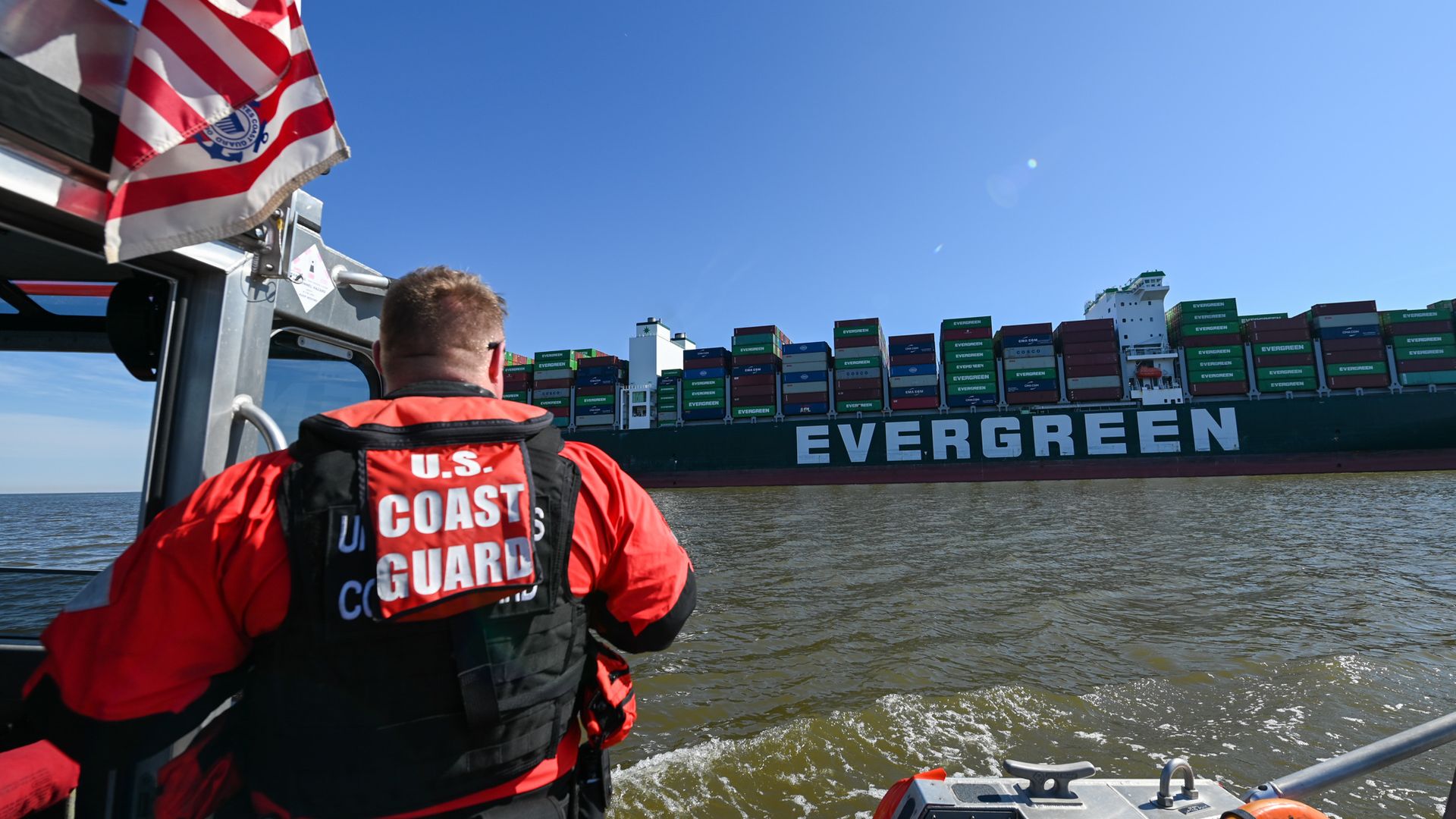 A Coast Guard grew monitors the Ever Forward, which is grounded in thee Chesapeake Bay.