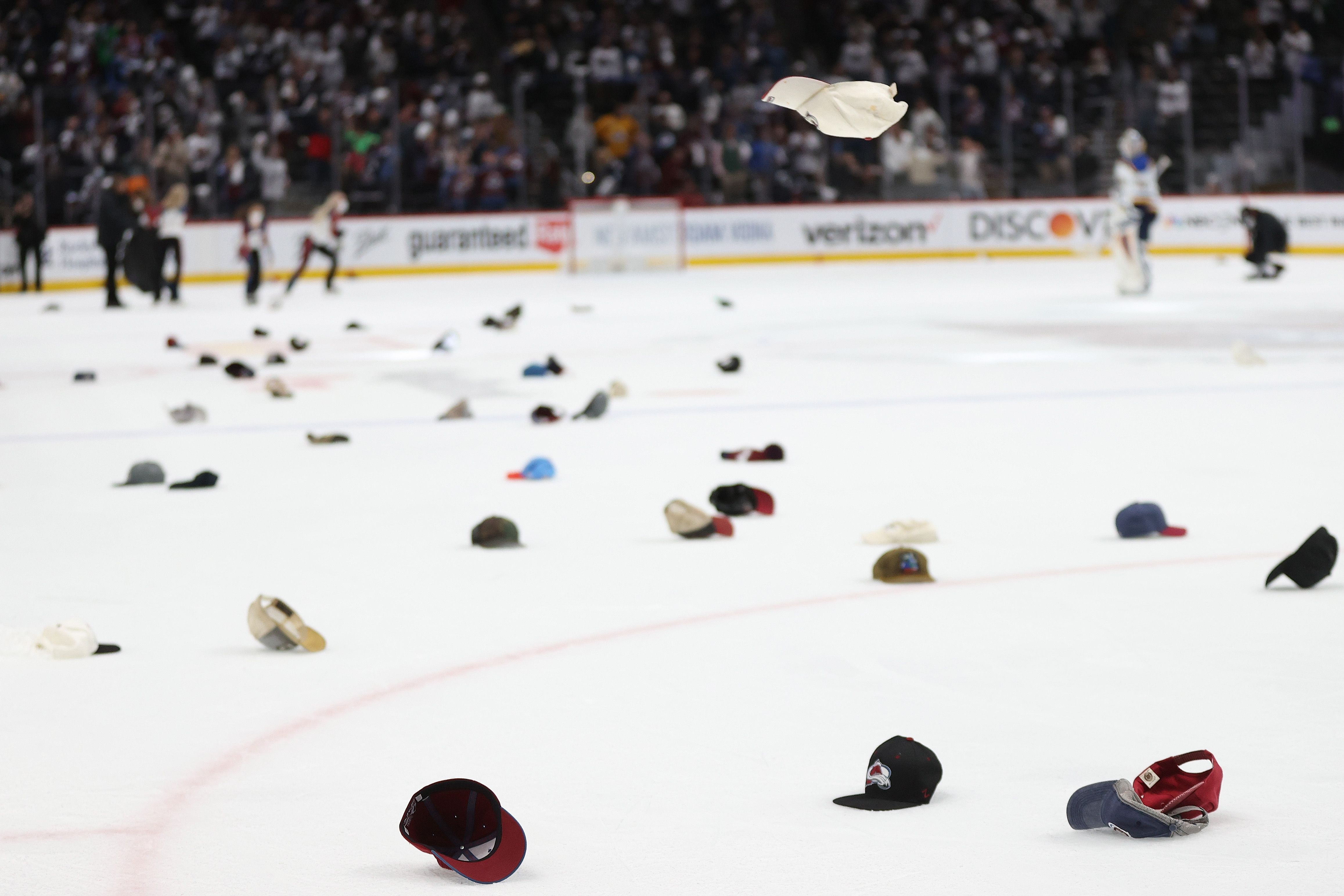 Hats being thrown on ice