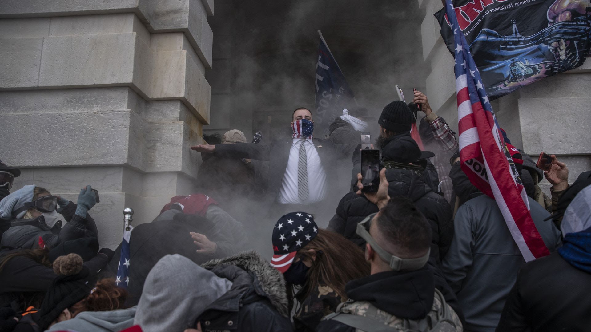 Amid smoke and chaos, Demonstrators attempt to breach the U.S. Capitol on Wednesday, Jan. 6, 2021. 