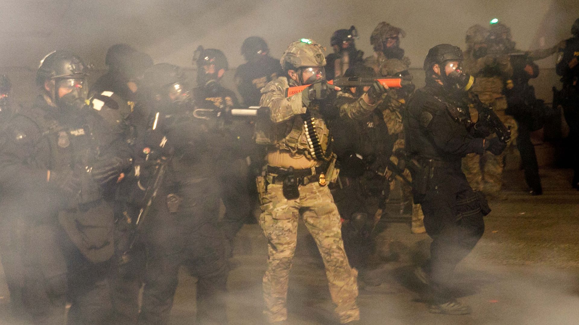 Federal officers fire tear gas and rubber bullets at the demonstrators in Portland, Oregon on July 21, 2020.