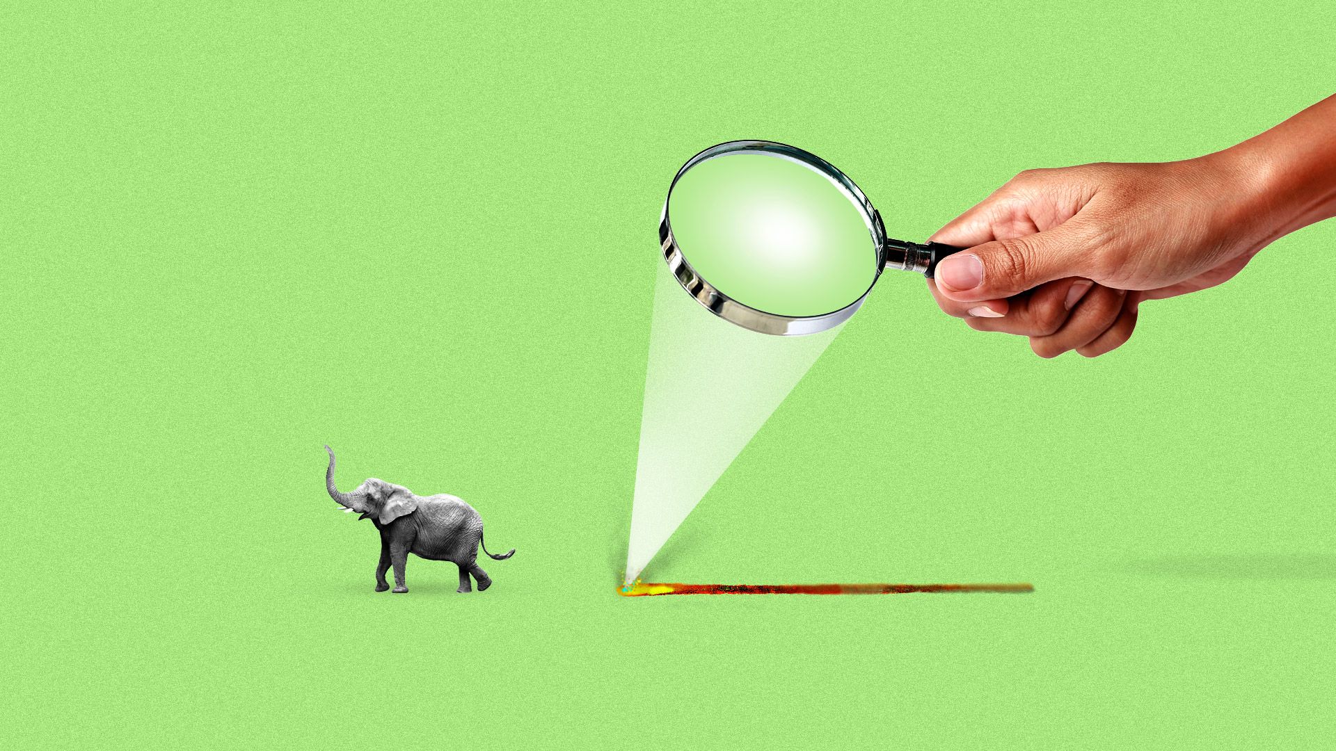 A tiny elephant runs away from a trail of fire caused by a man focusing the sun through a magnifying glass. 