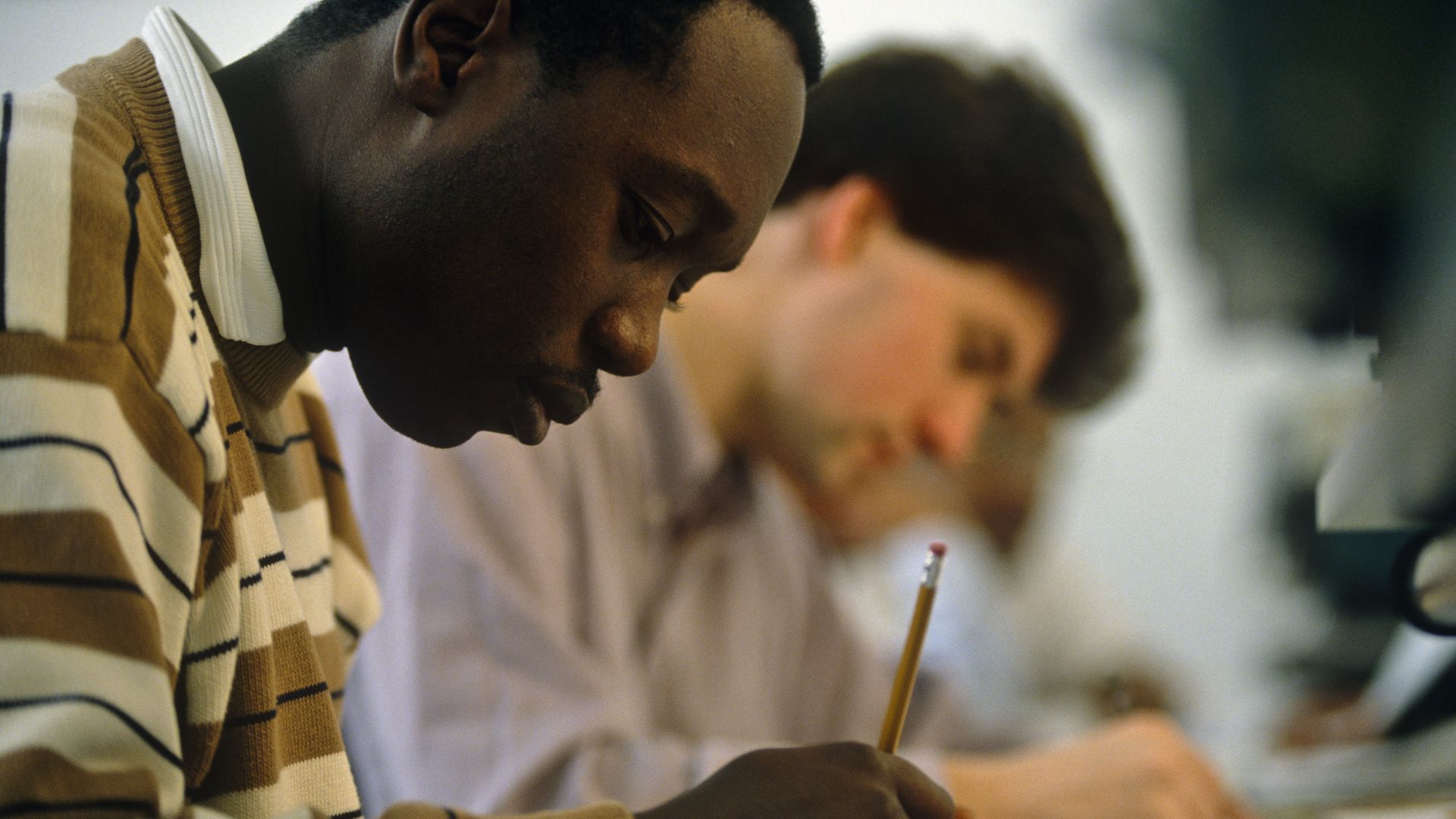 A black student and a white man