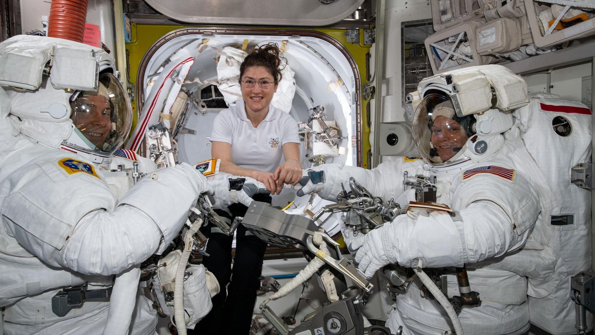 NASA astronauts Nick Hague (L), Christina Koch (C), and Anne McClain (R) 
