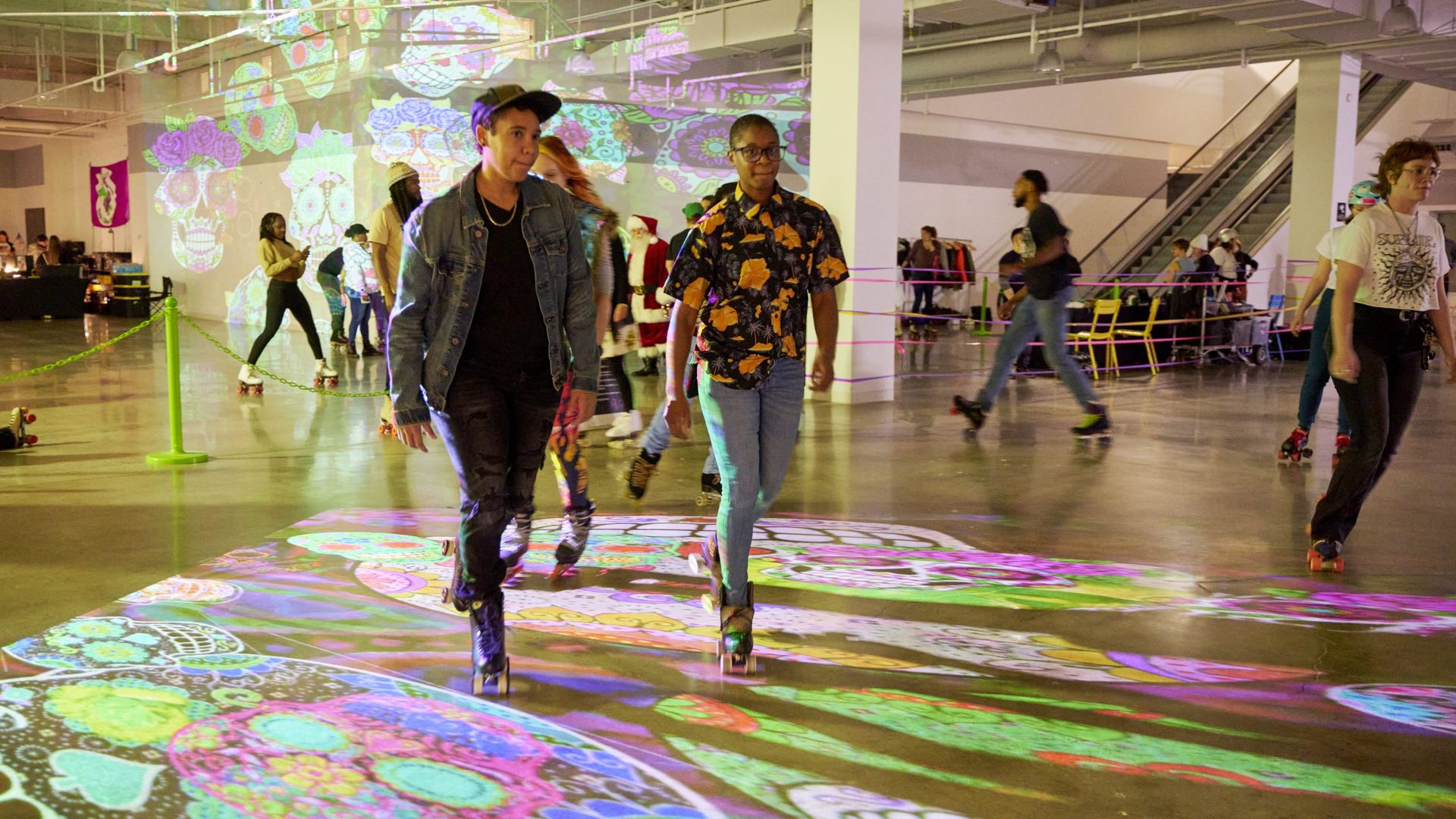 A photo of people rollerskating indoors.
