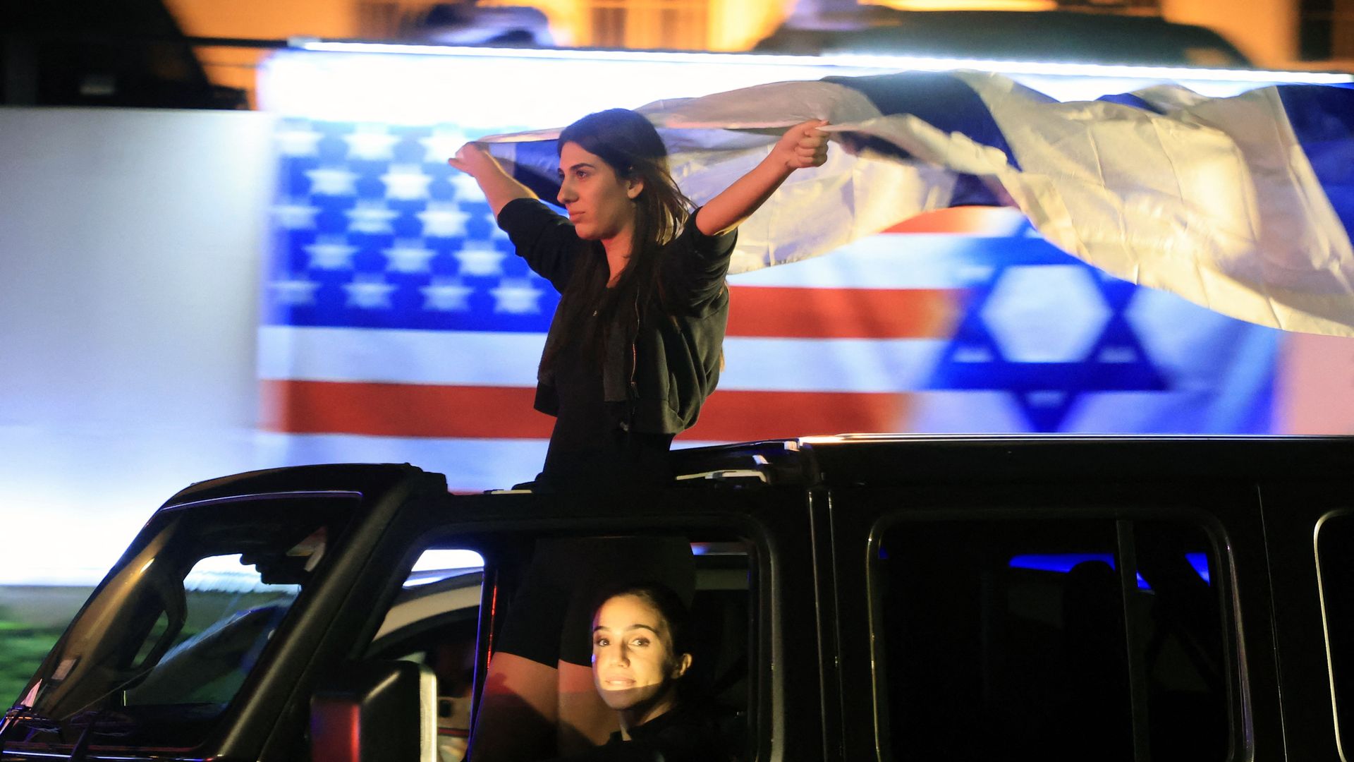 Supporters of Israel demonstrate with national flags in Beverly Hills, California, on October 9, 2023, after the Palestinian militant group Hamas launched an attack on Israel. 