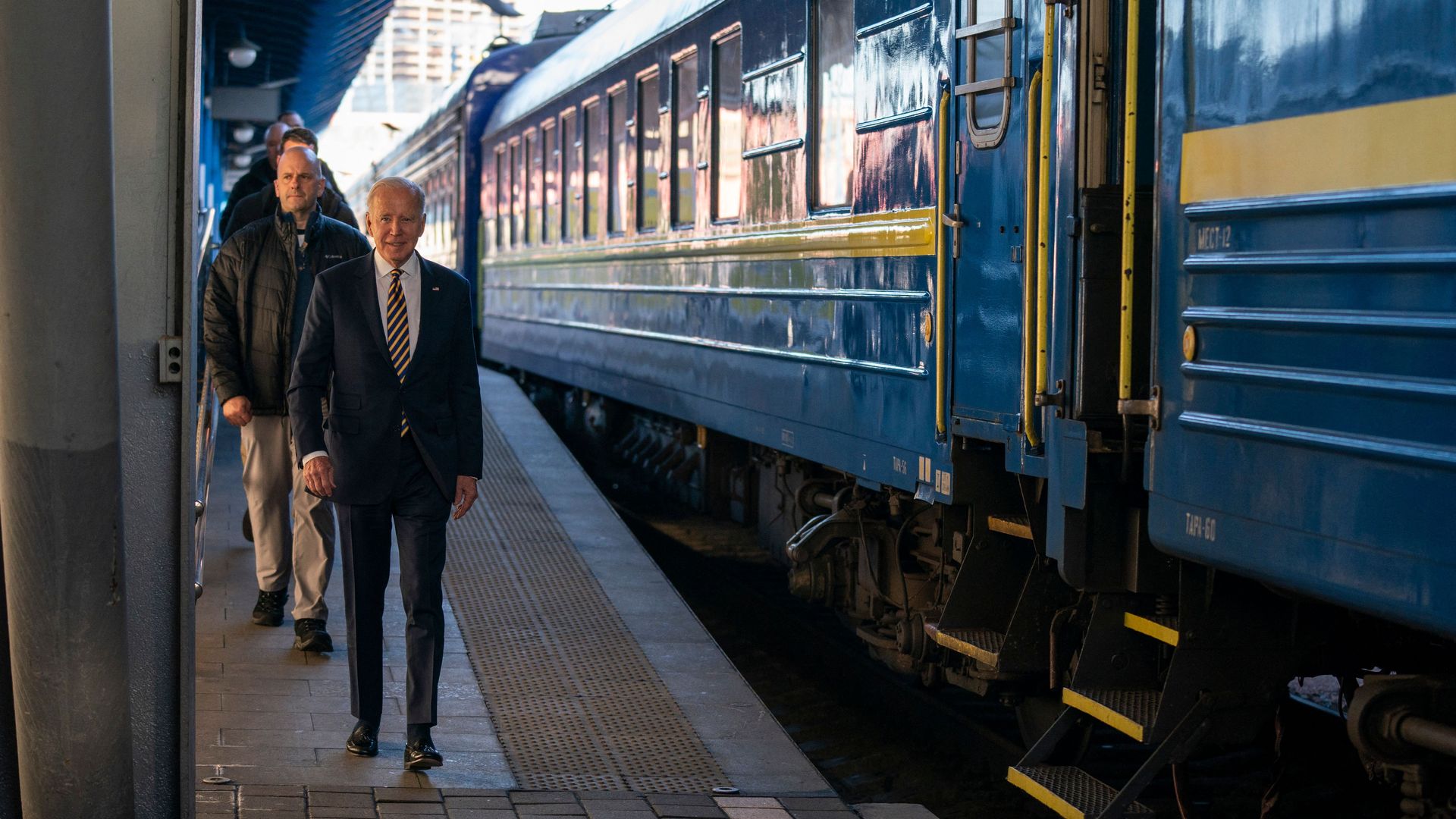 Joe Biden walks along the train platform after a surprise visit to meet with Ukrainian President Volodymyr Zelenskyy, in Kyiv on February 20