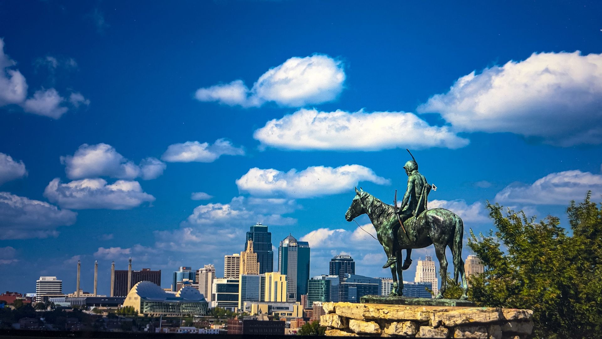 white puffy clouds over Kansas City Missouri.