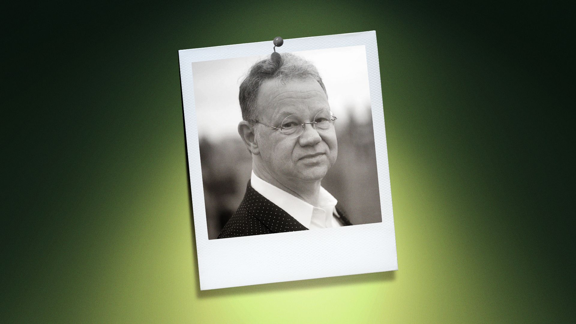 Photo illustration of George Smart in a polaroid photo lit by a lime-green light. 