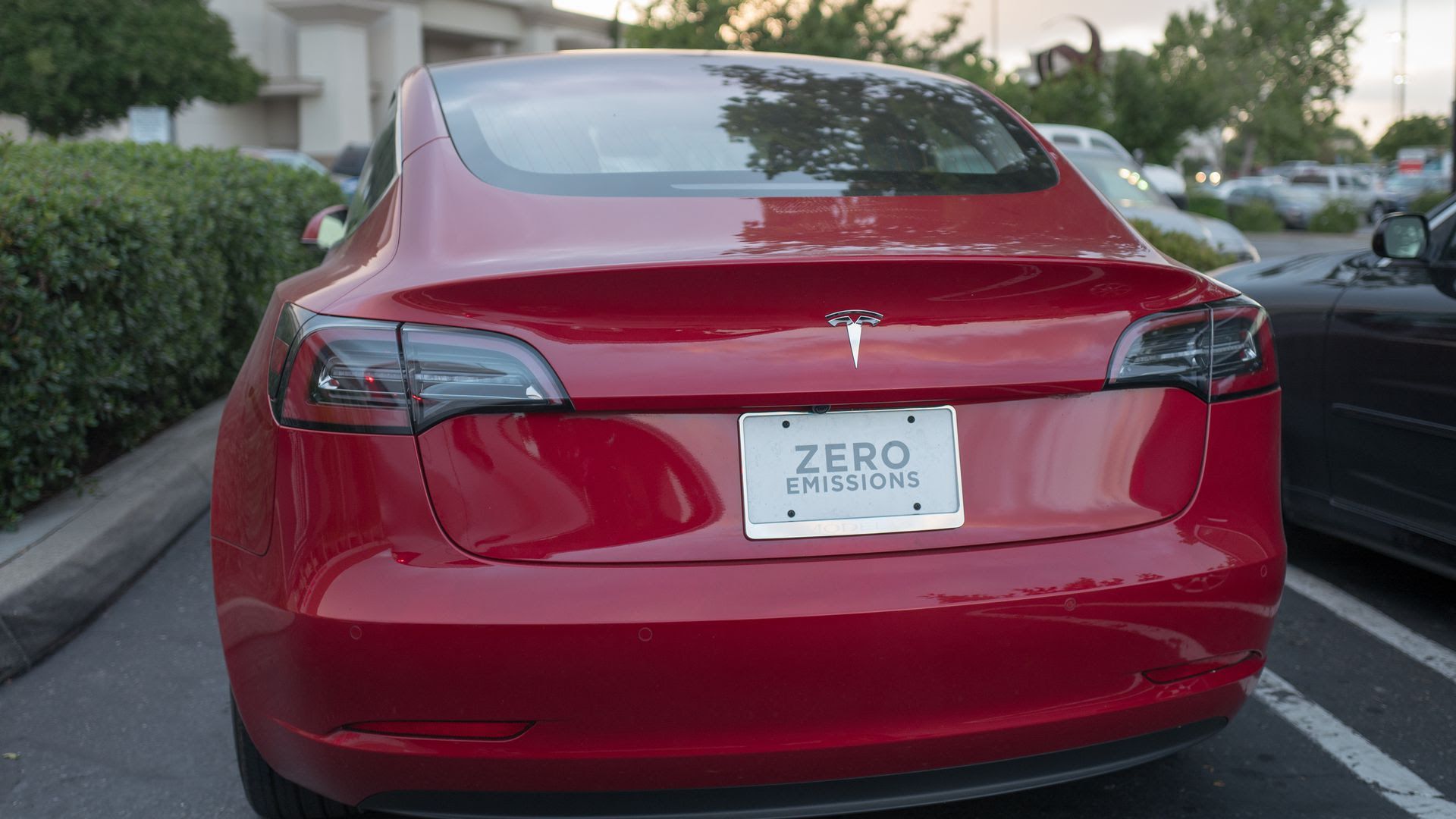 Tesla Model 3 license plate reads "Zero Emissions"