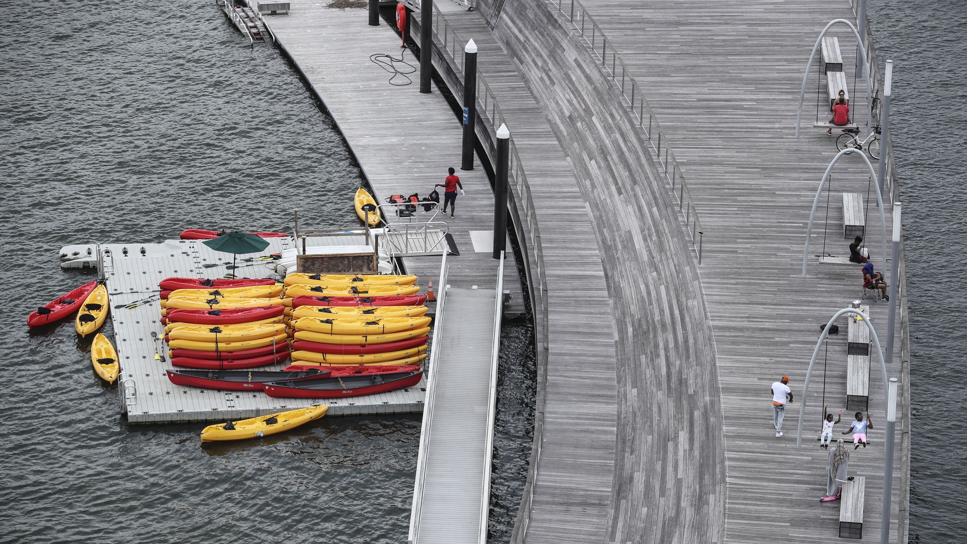 People enjoy the day on the pier