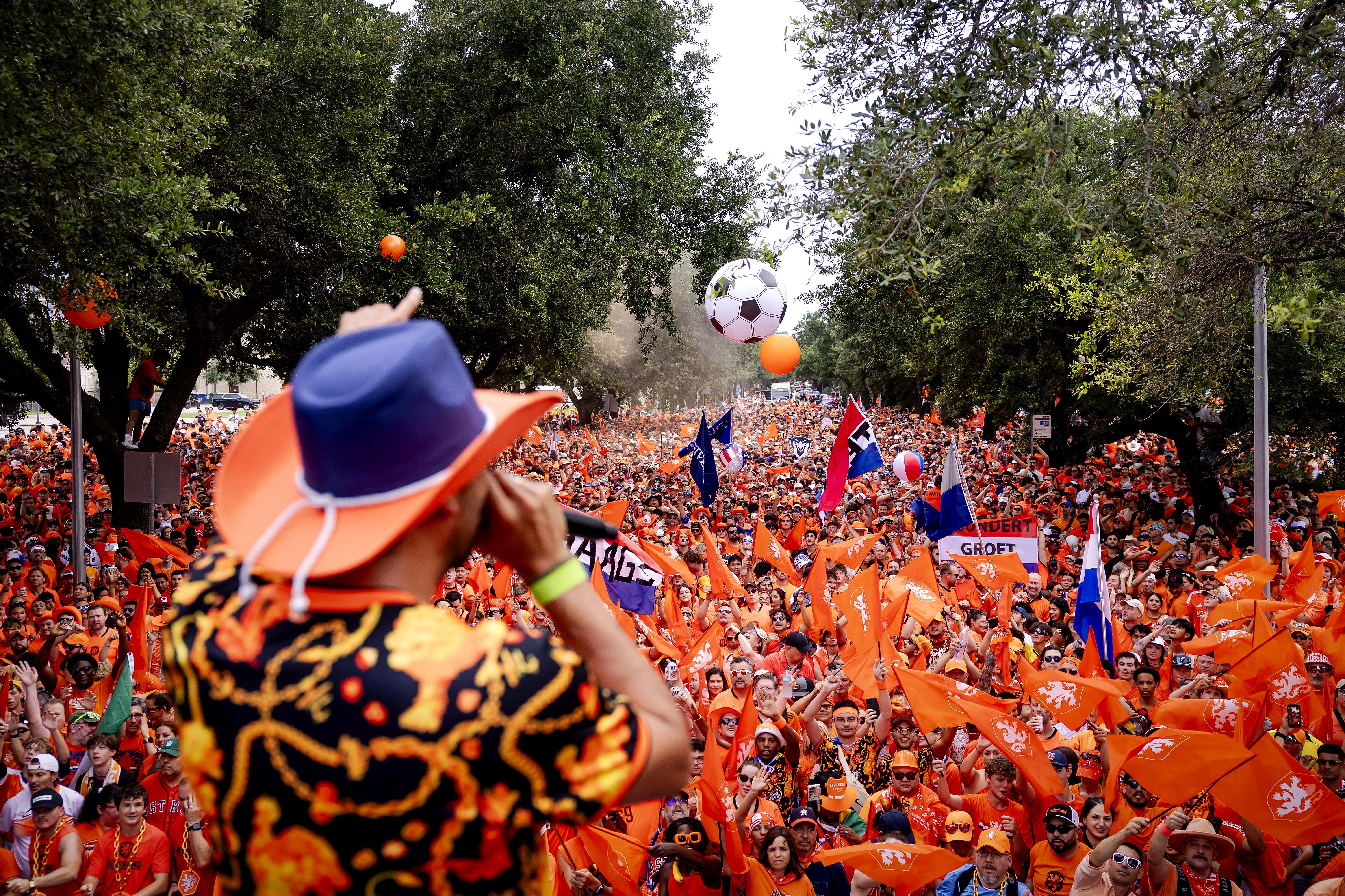 Thousands of people in orange marching through Houston's streets.