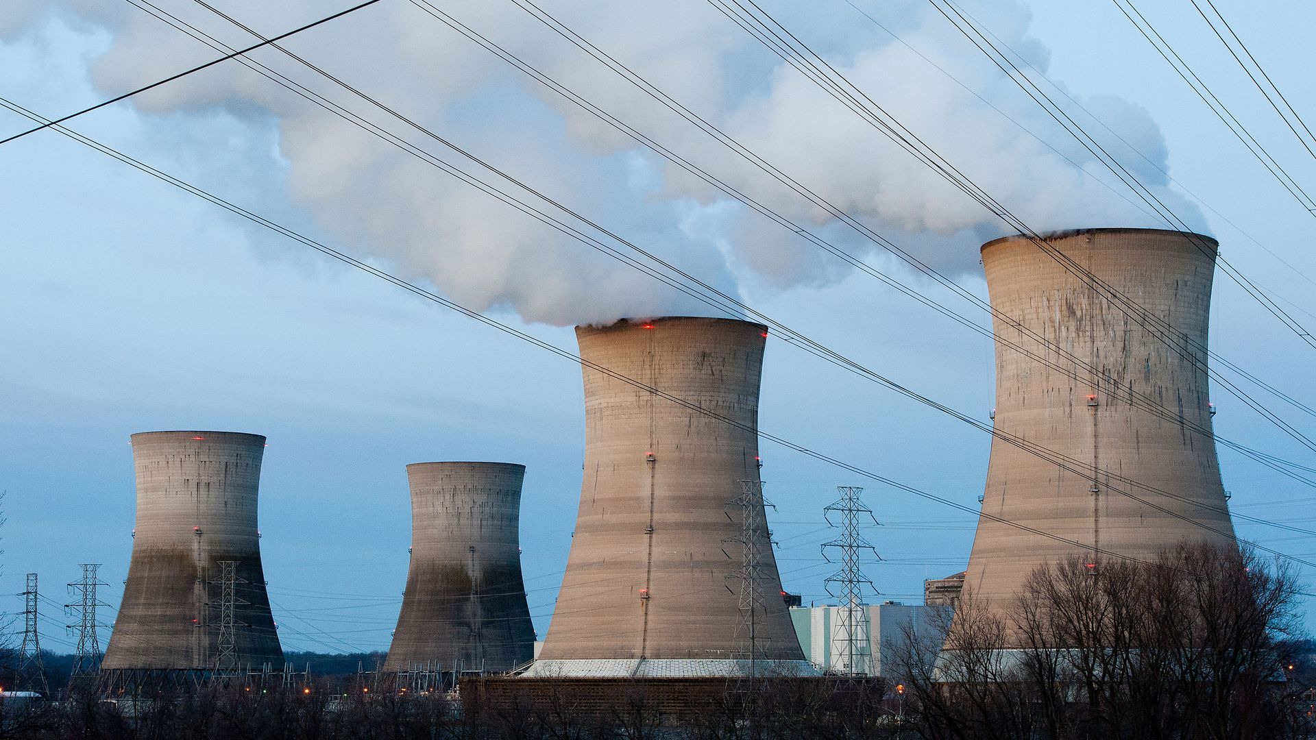 In this image, nuclear reactors billow vapor into the air.