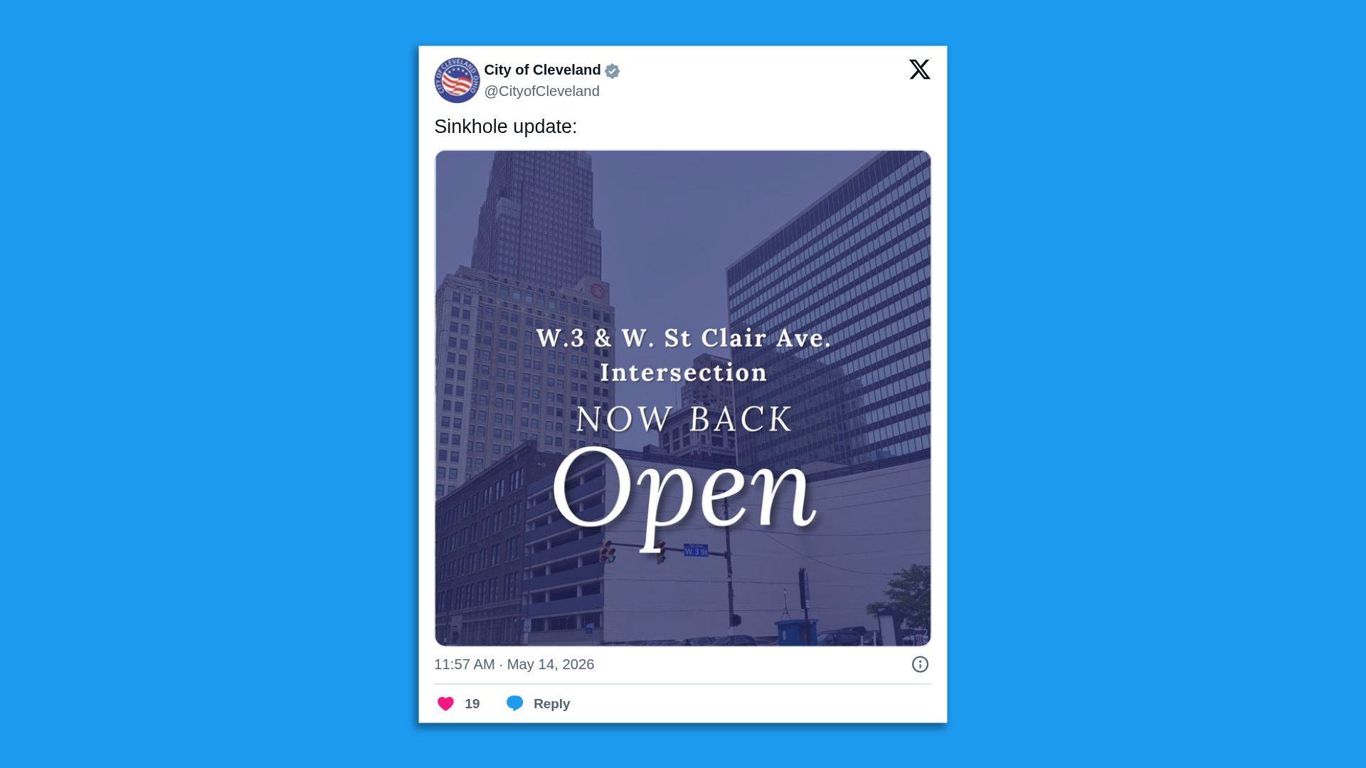 Tweet-style post from City of Cleveland announcing a sinkhole update. It shows a blue-tinted photo of downtown buildings with white text reading "W.3 & W. St Clair Ave Intersection NOW BACK Open".