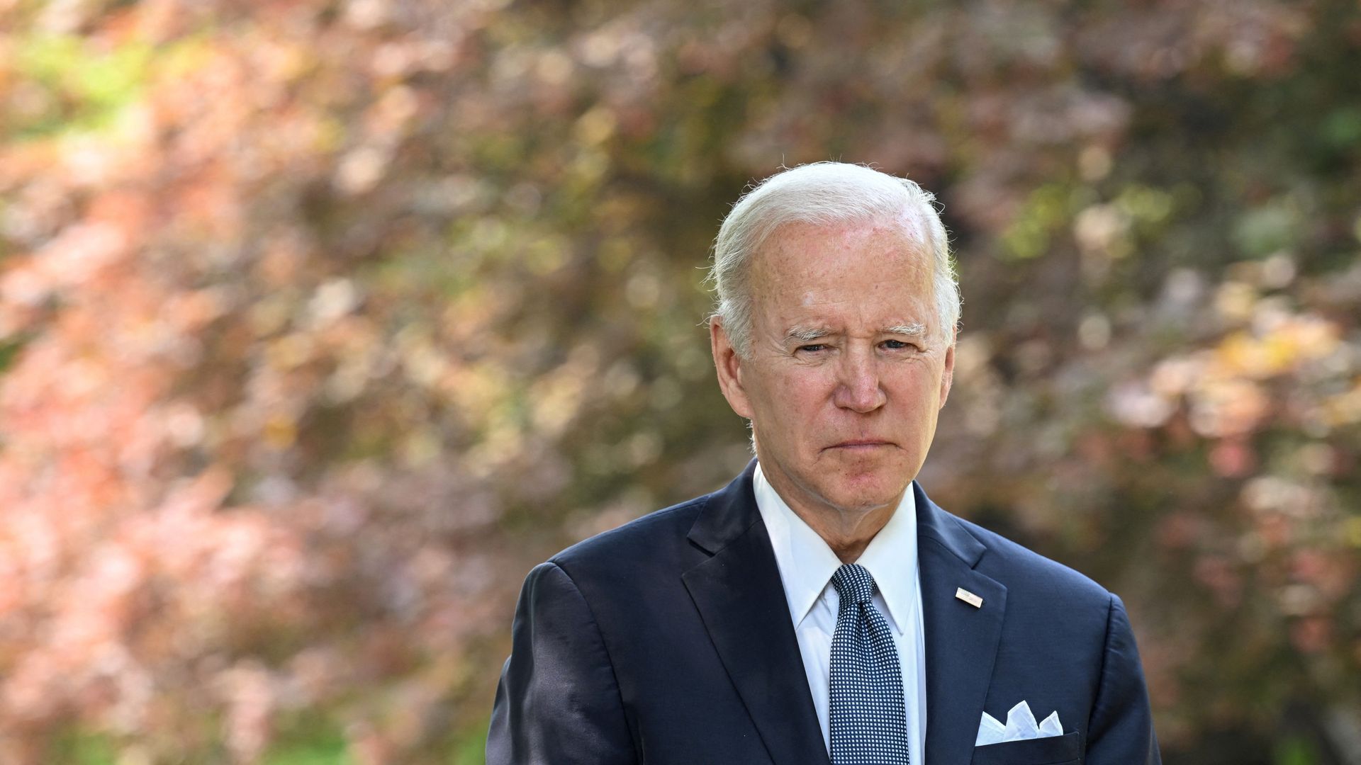 US President Joe Biden looks on while meeting the press 