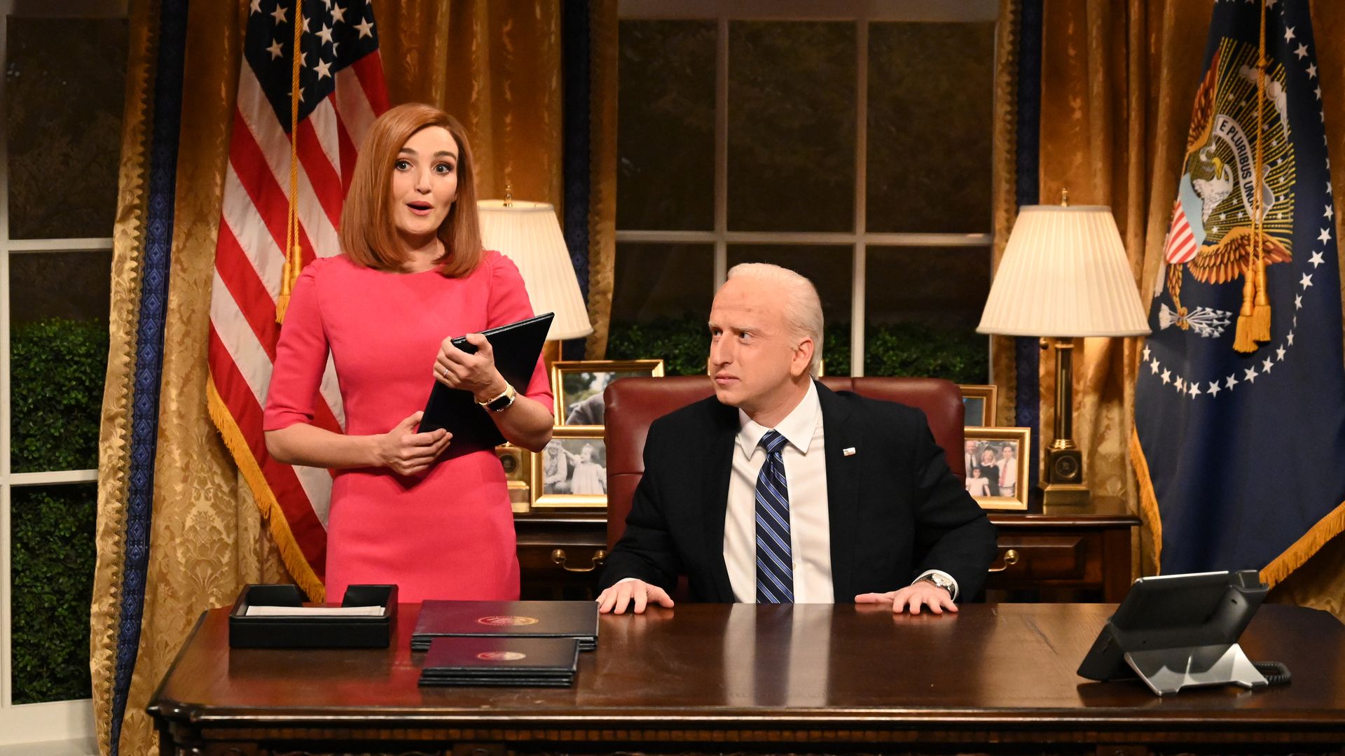 Two actors are seen portraying Jen Psaki and President Biden during a skit on 