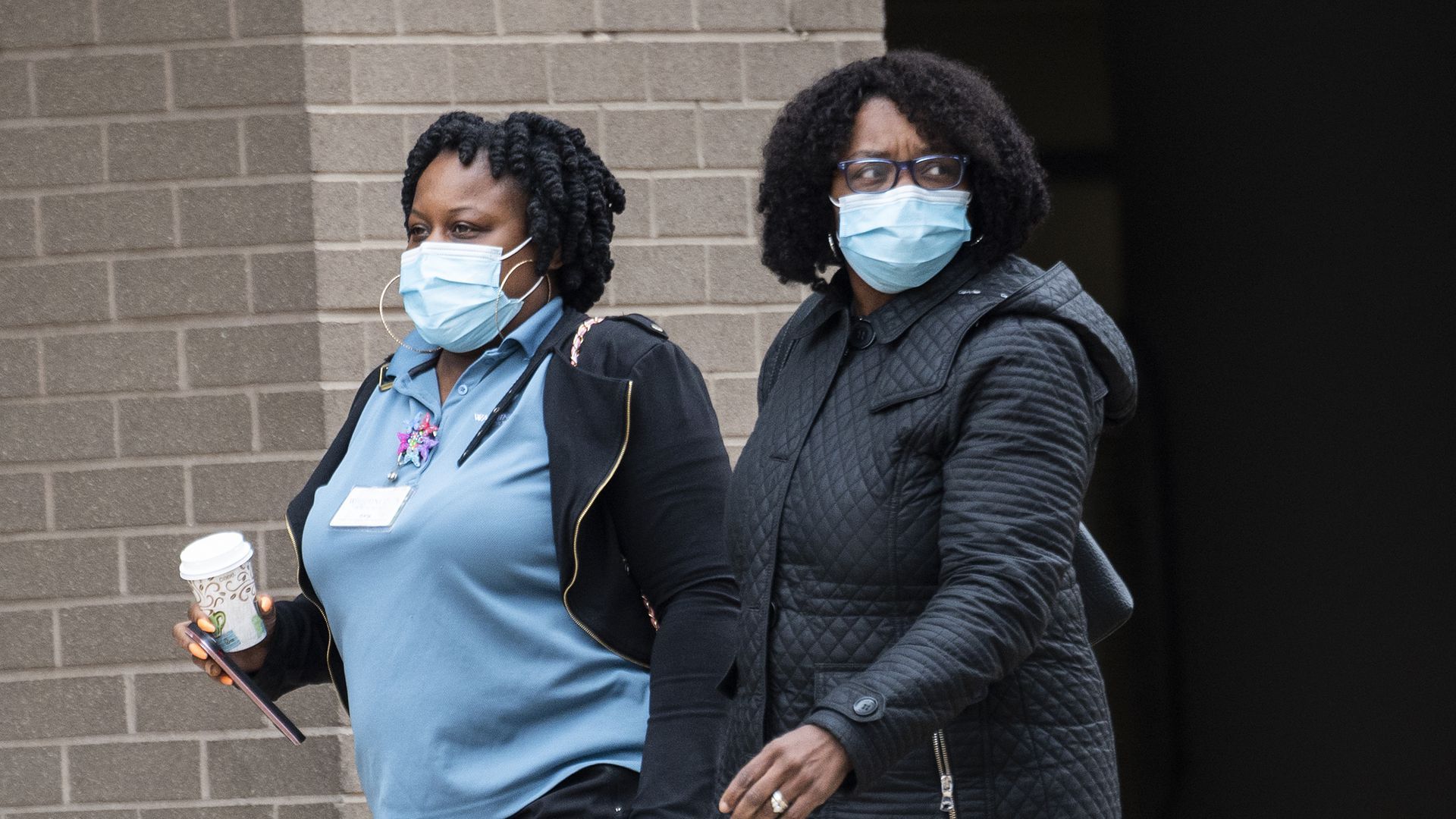 Medical workers wear masks as they walk back to GW hospital in D.C.