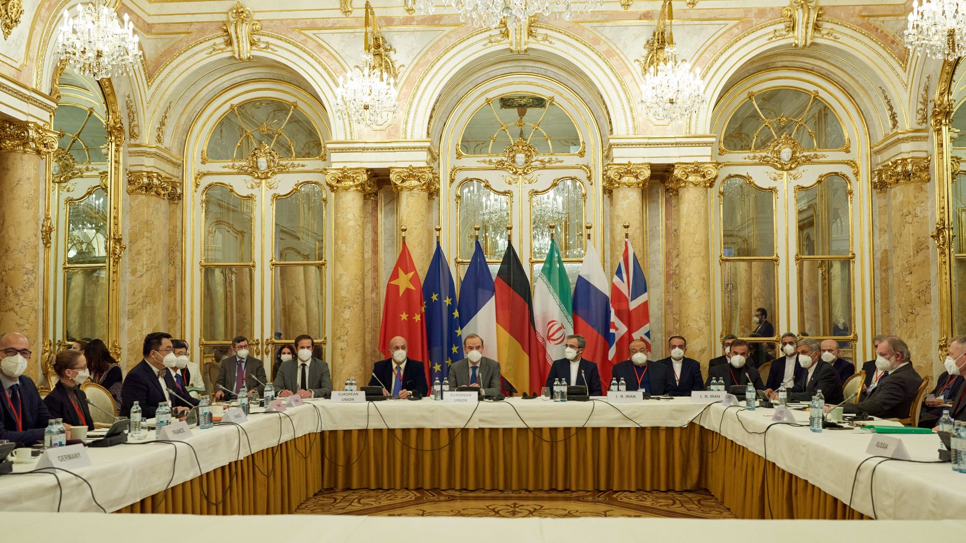 Officials are seen sitting in a Vienna hotel ballroom during the first day of the latest round in nuclear talks with Iran.