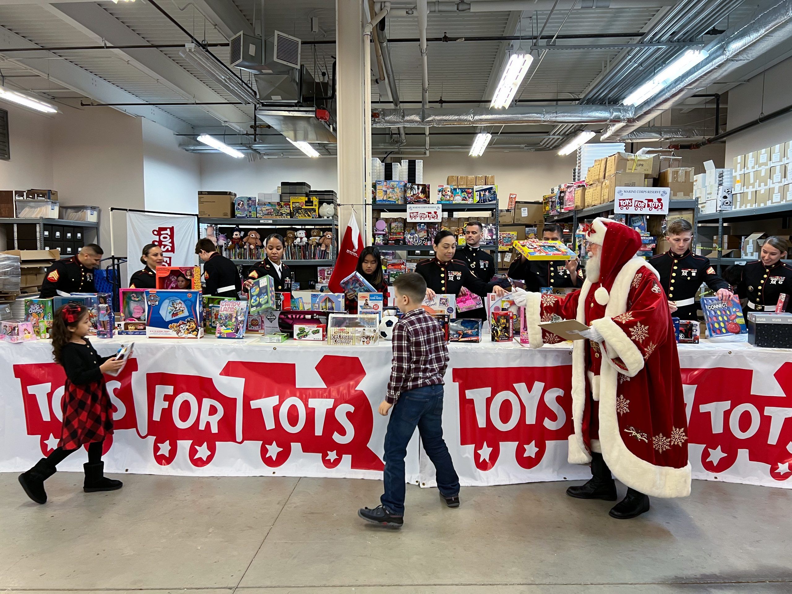 Children pick up the donated toys