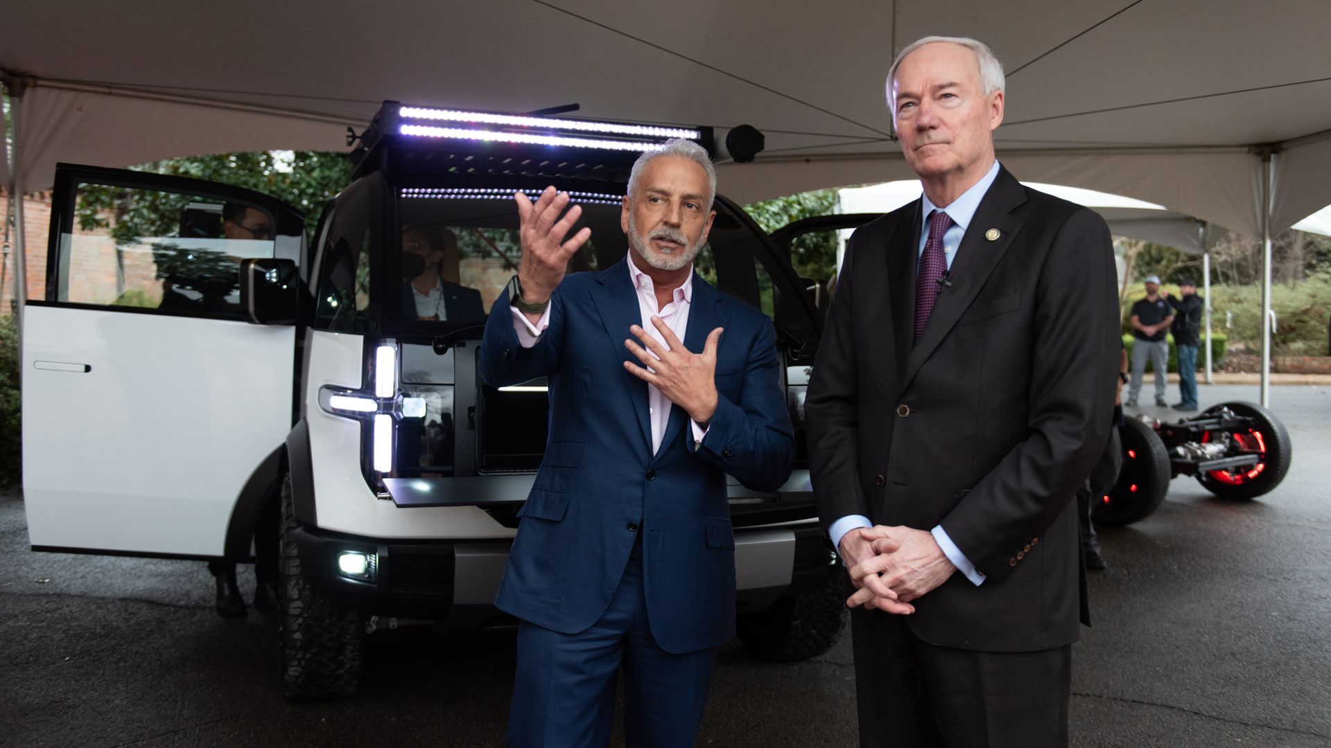 Canoo CEO Tony Aquila shows off a Canoo vehicle to Gov. Asa Hutchinson at an event last year.