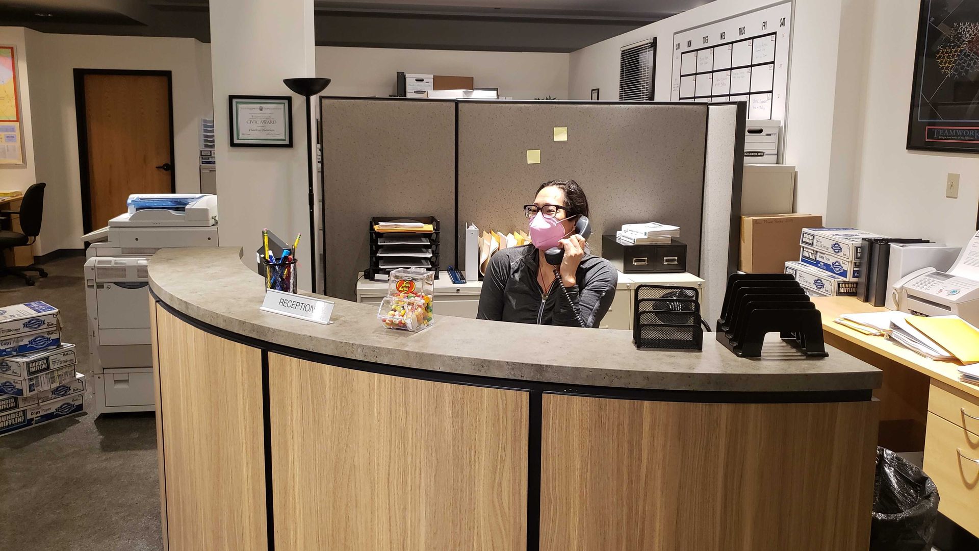 Woman at reception desk. 