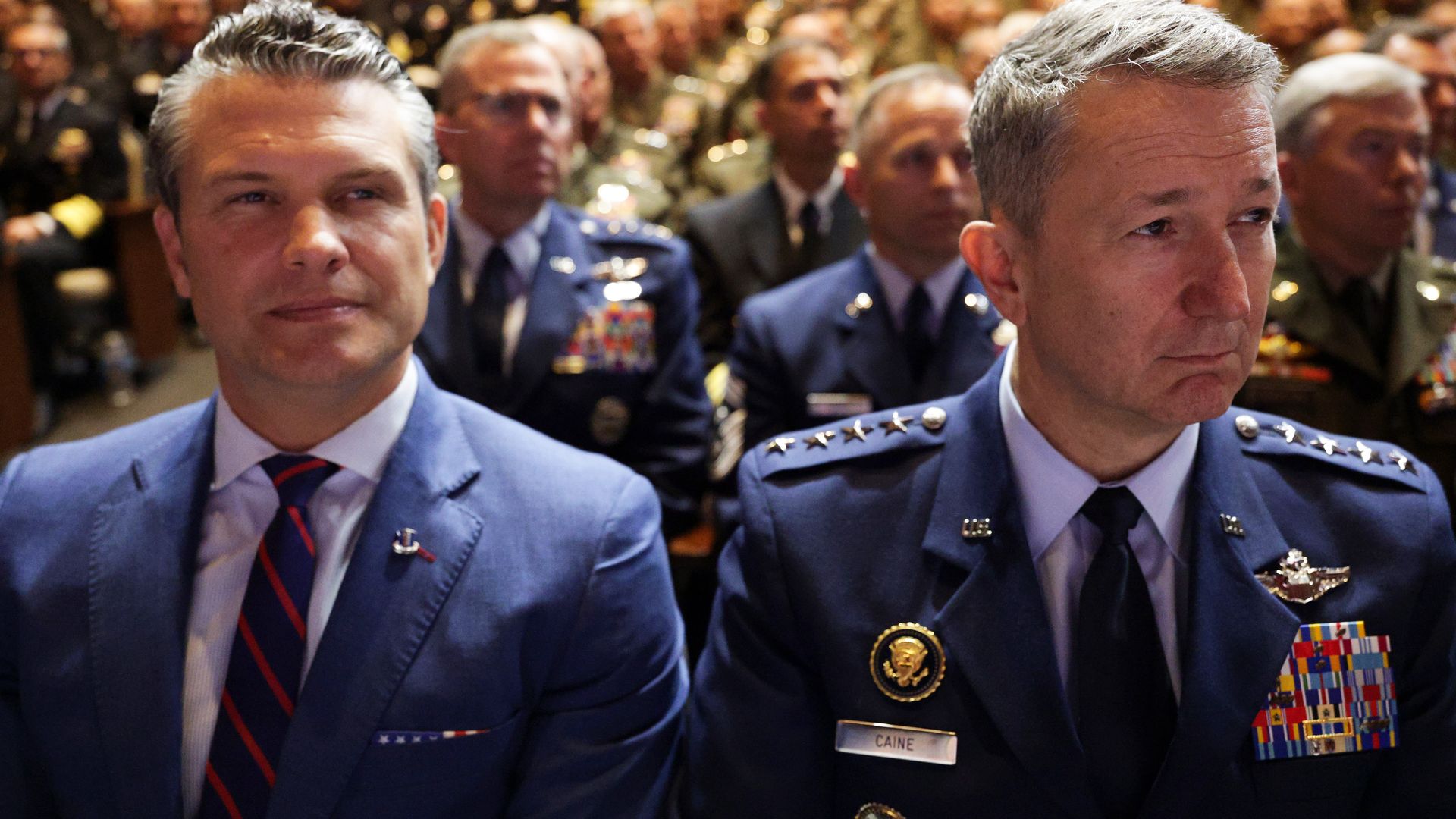 Men sitting in uniform