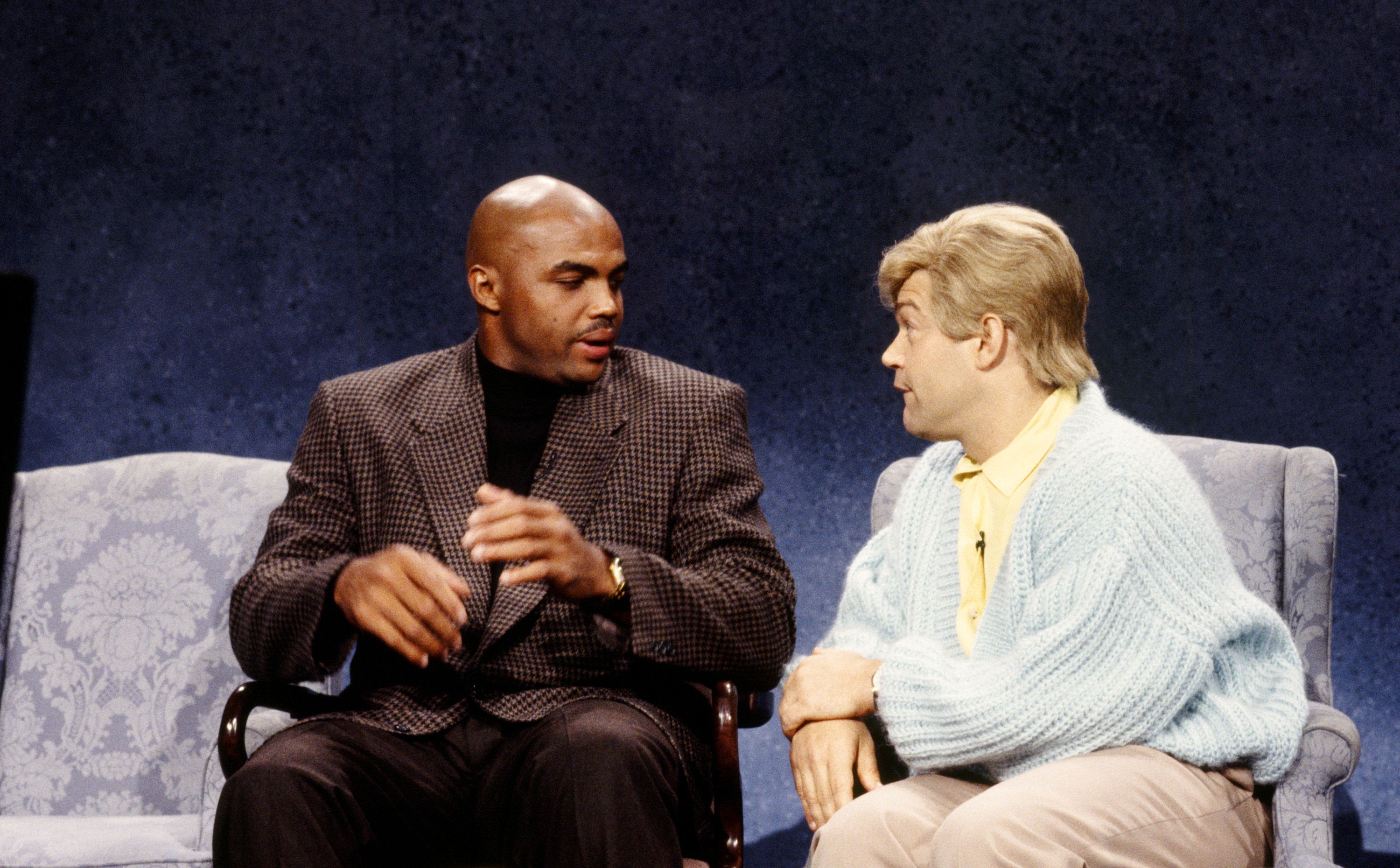 Two people on a stage.